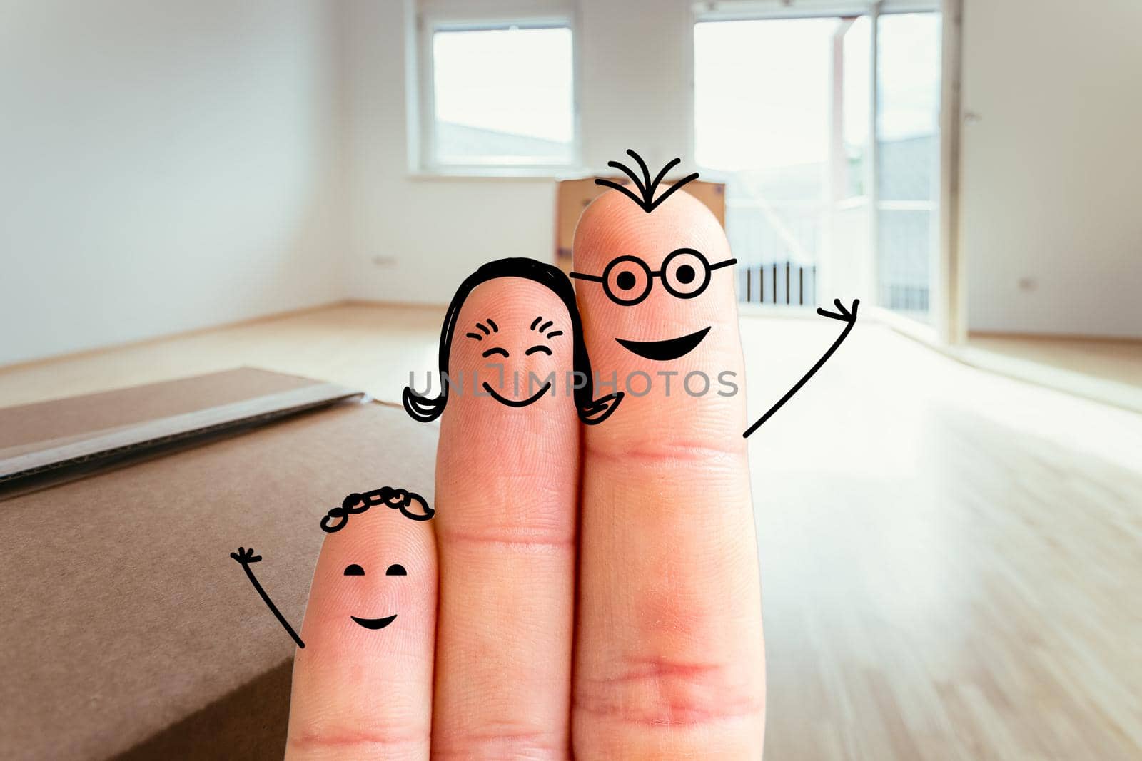 Painted fingers happy family concept moving into a new home