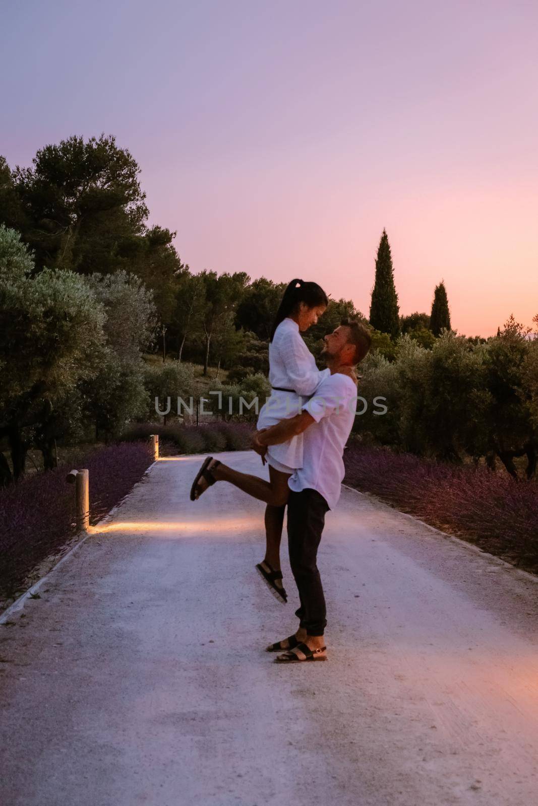 couple walking path with lavender during sunset in the Provence France Europe