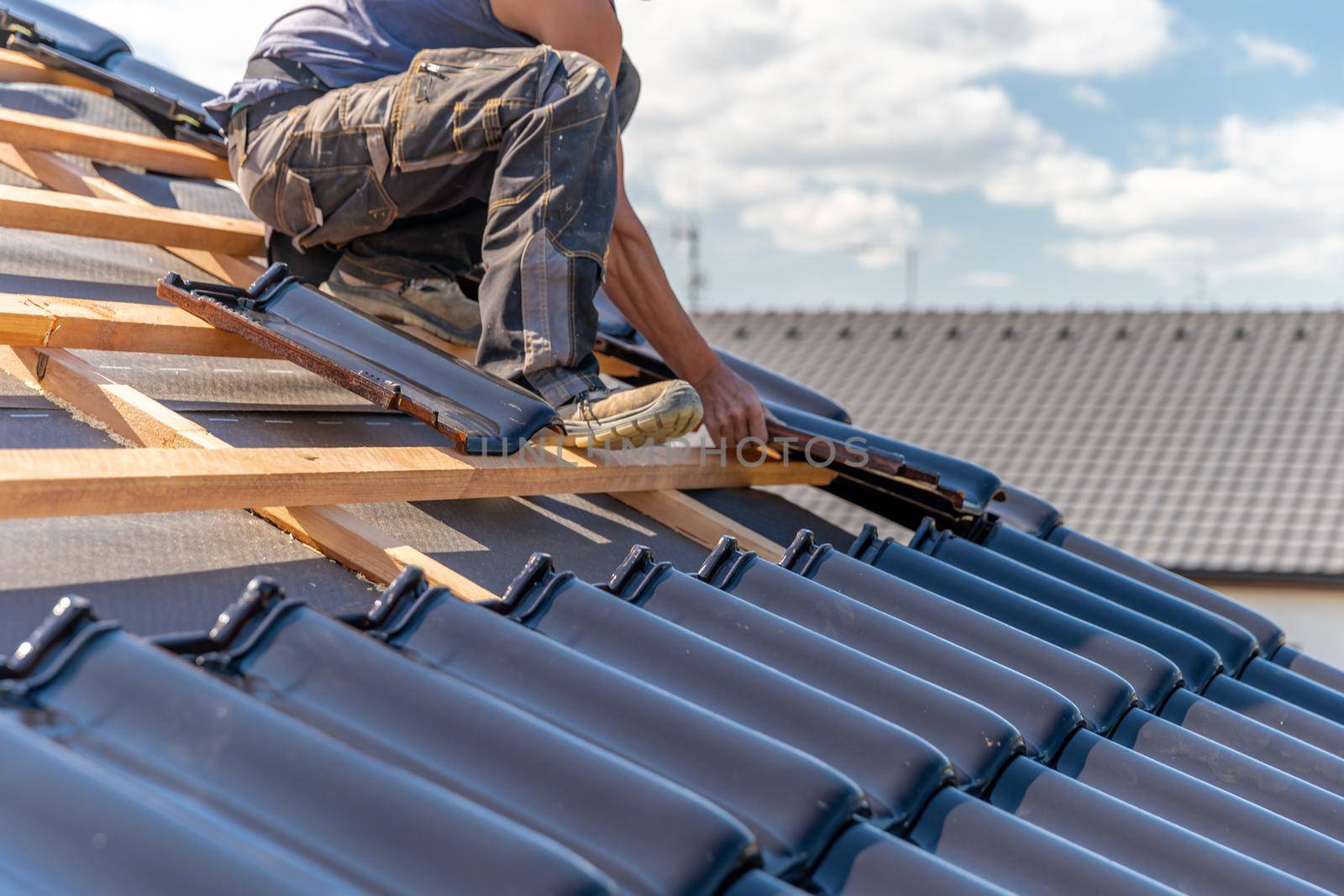 manufacture of the roof of a family house from ceramic tiles. copy space