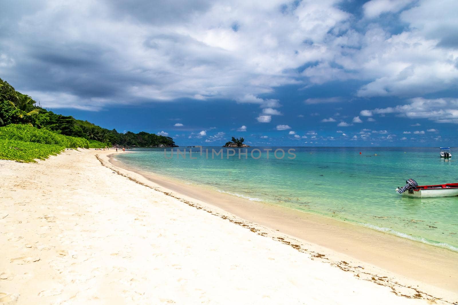 Paradise beach anse royale on Seychelles island Mahé with turguoise water, palms, white sand and granite rocks