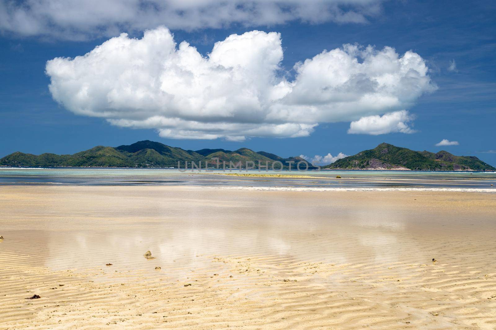 Beautiful beach Anse Source D'Argent on Seychelles island La Digue with white sand and blue sky with white clouds