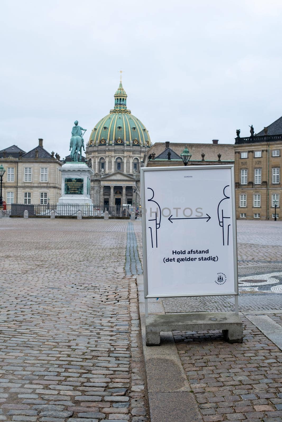 Keep Distance Sign on Amalienborg Palace Square in Copenhagen by oliverfoerstner