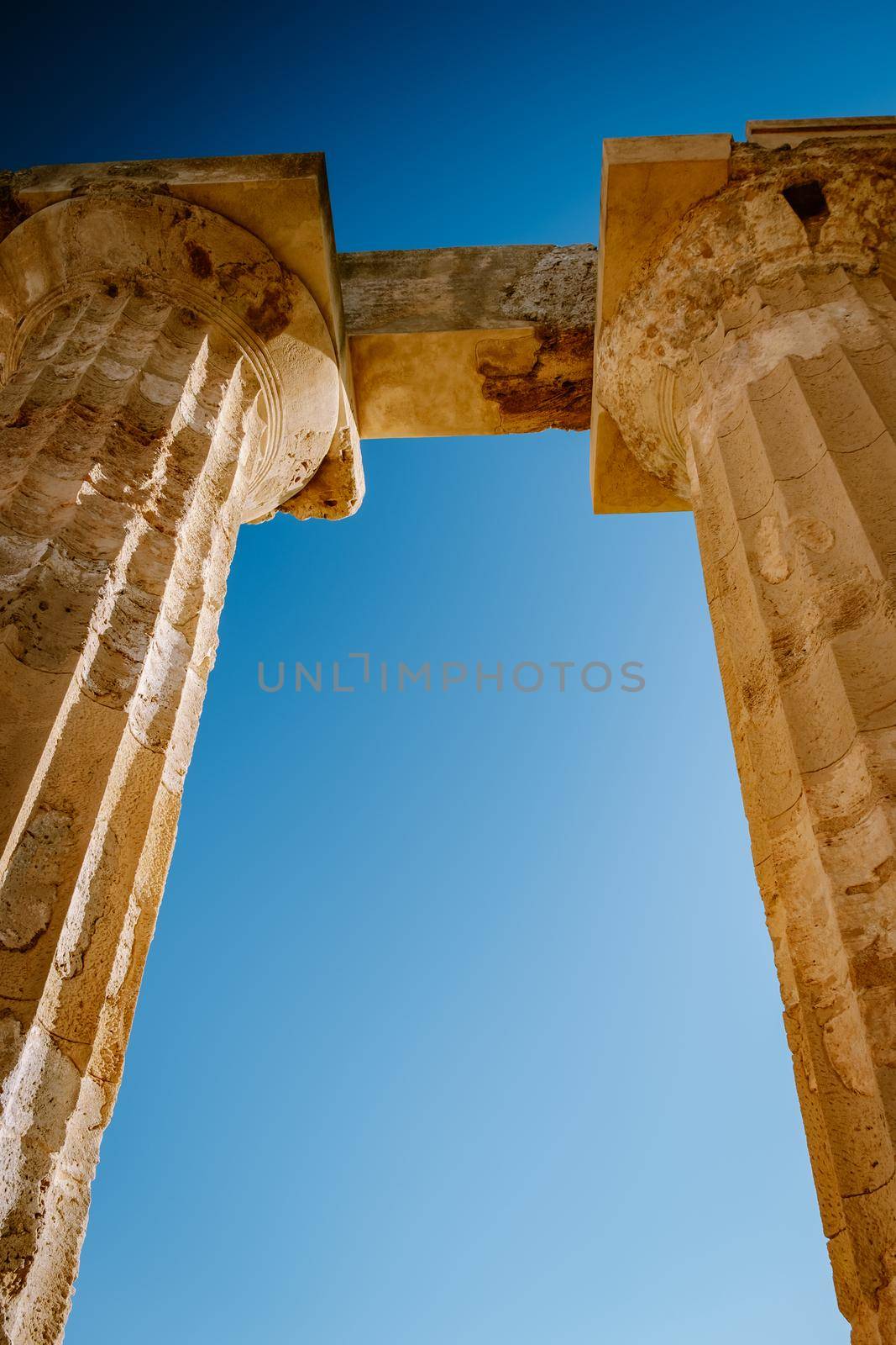 View on sea and ruins of greek columns in Selinunte Archaeological Park by fokkebok