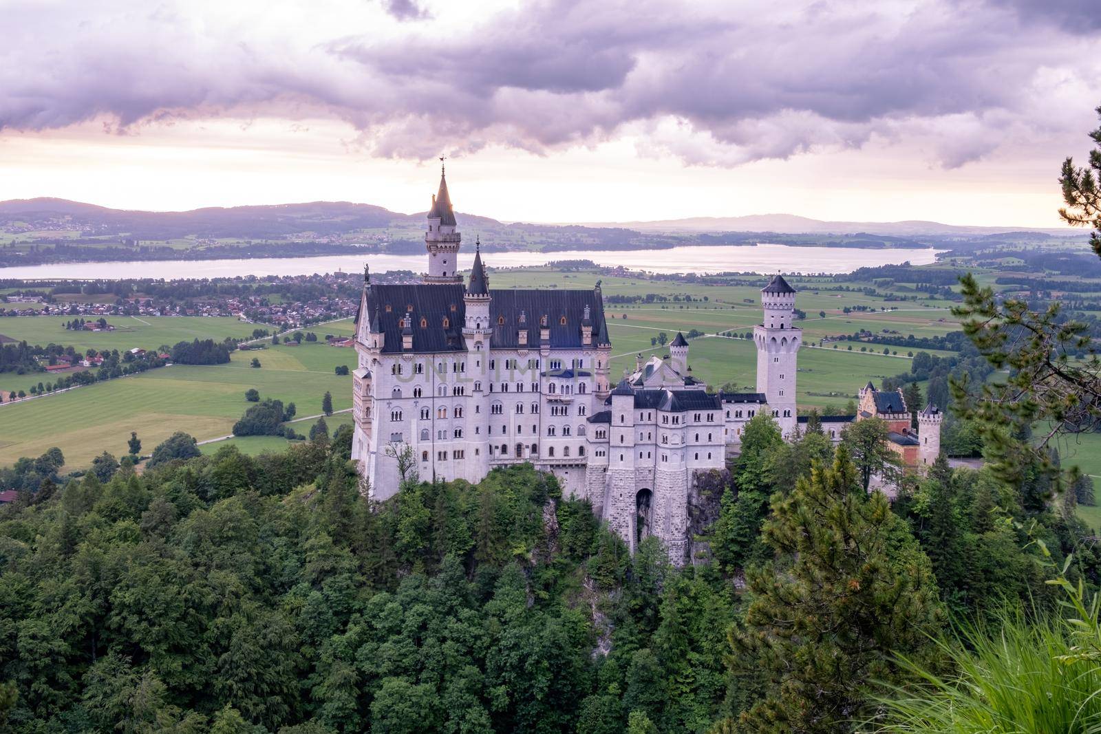 Beautiful view of world-famous Neuschwanstein Castle, the nineteenth-century Romanesque Revival palace built for King Ludwig II on a rugged cliff near Fussen, southwest Bavaria, Germany by fokkebok