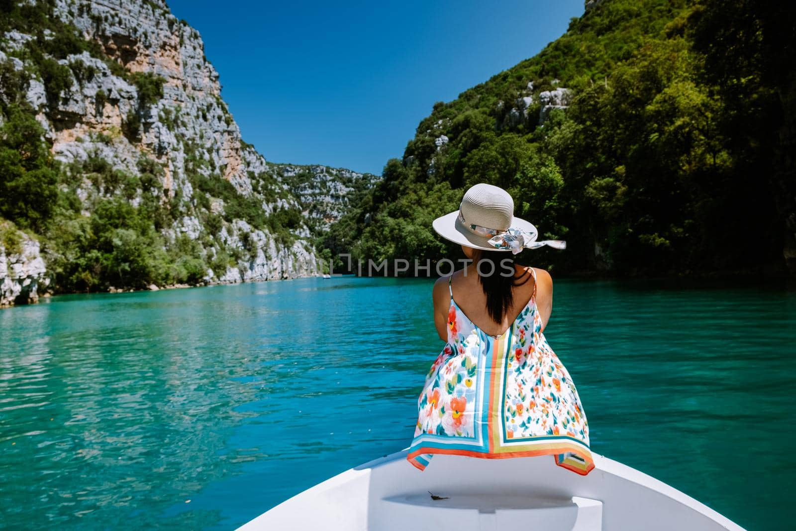 young girl view to the cliffy rocks of Verdon Gorge at lake of Sainte Croix, Provence, France, near Moustiers SainteMarie, department Alpes de Haute Provence, region Provence Alpes Cote Azur. France