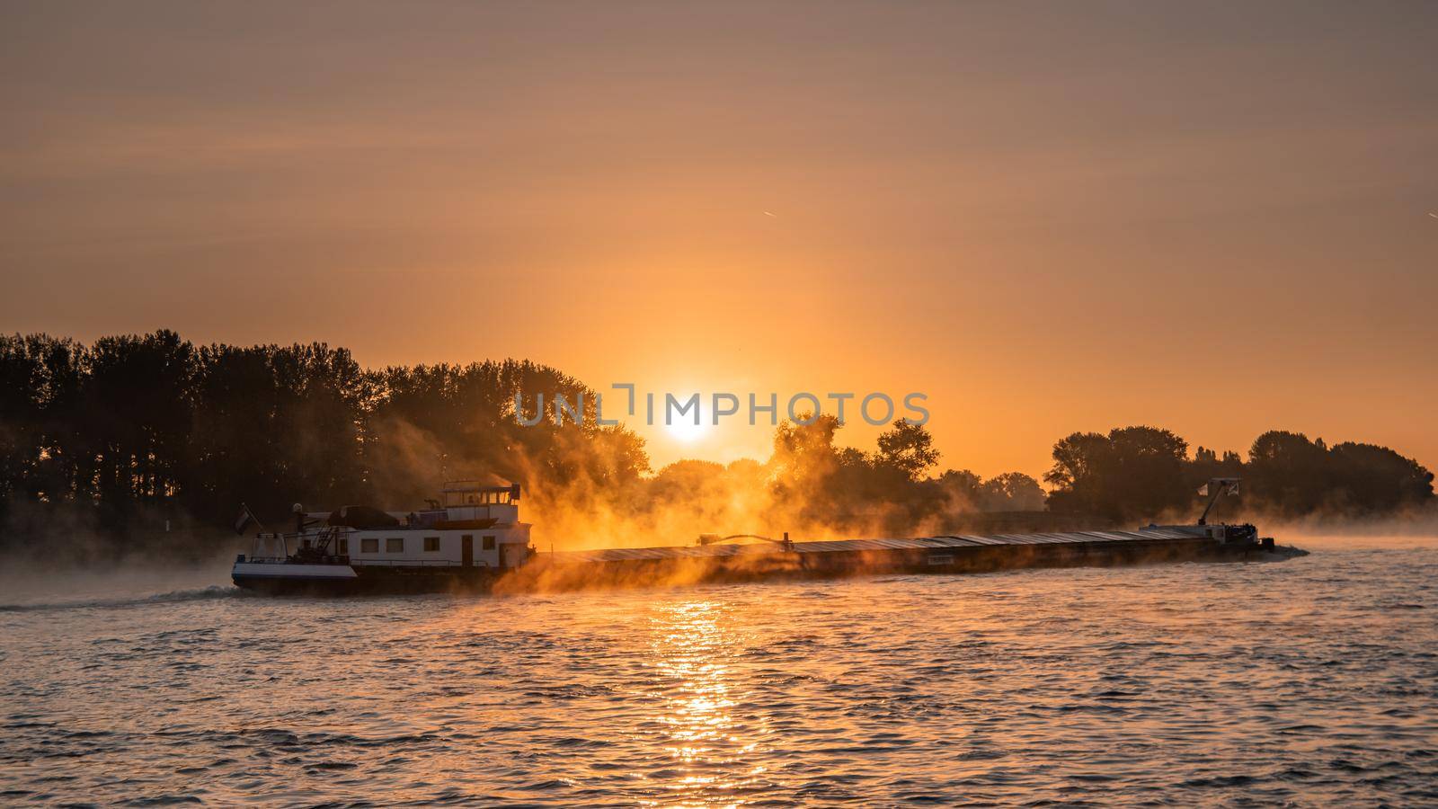 Cologne Germany August 2020, Inland shipping transport on the rhine river with containers, Large container and oiltanker vessel on the river rhein in Germany Europe