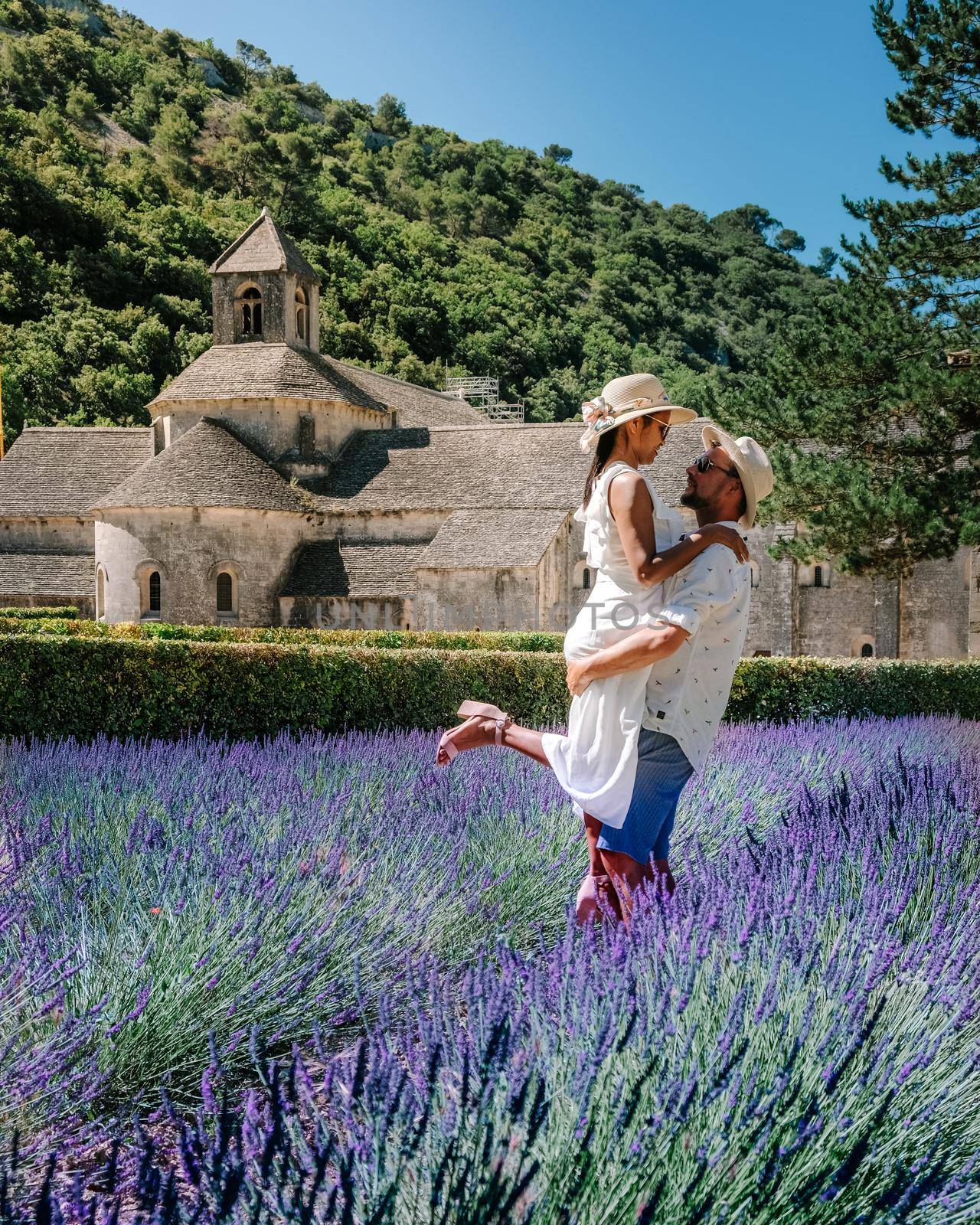 couple mid age men and woman on vacation in the Provence visiting the blooming lavender fields in France. Europe