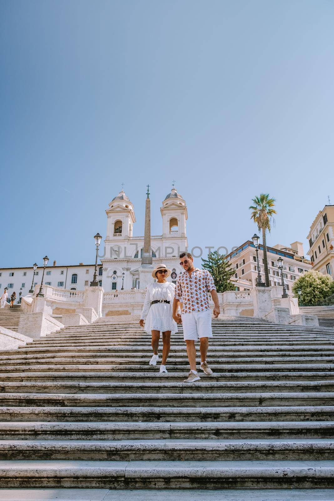 The Spanish Steps in Rome, Italy. The famous place is a great example of Roman Baroque Style. Italy couple on city trip in Rome