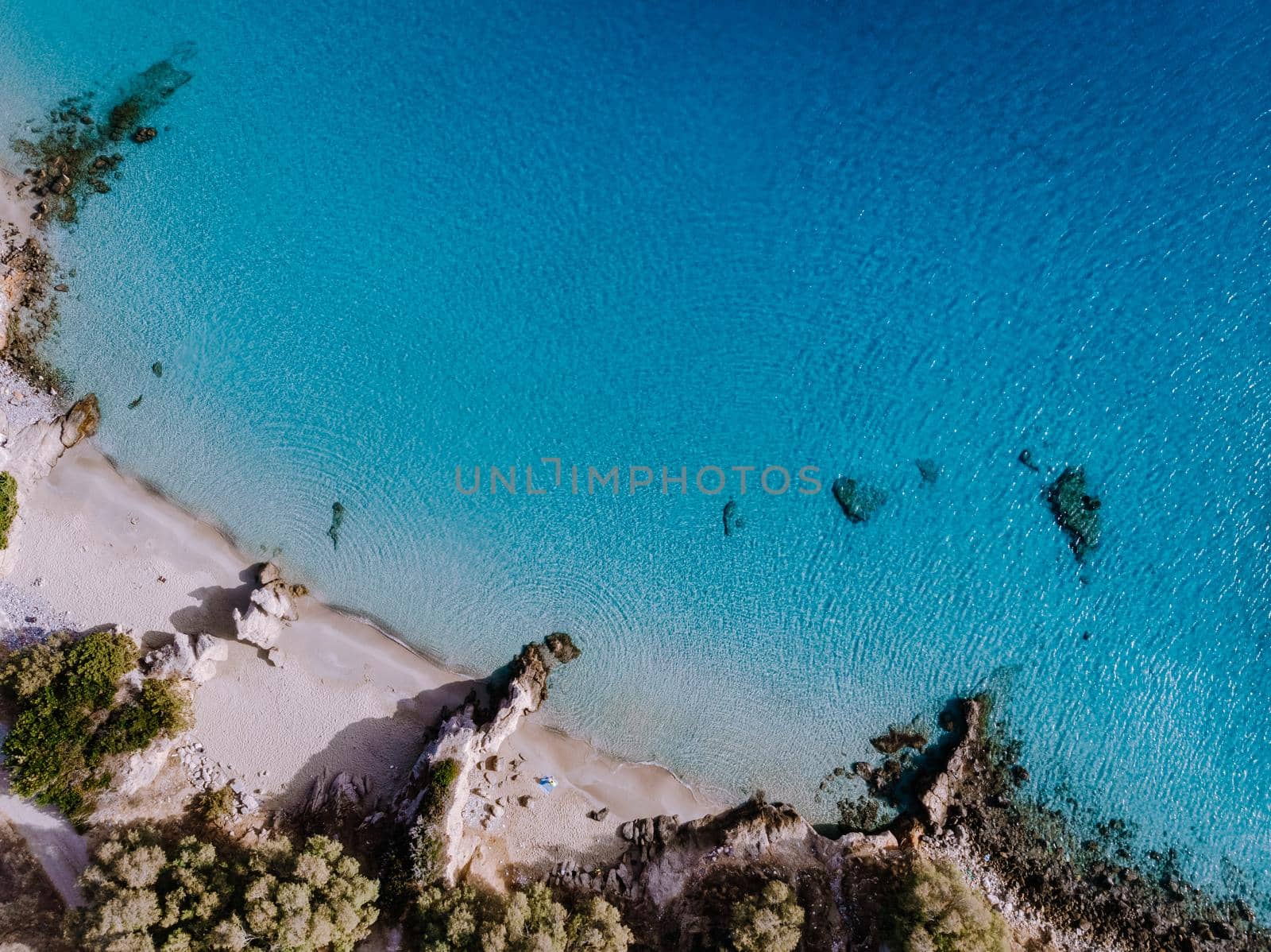 Tropical beach of Voulisma beach, Istron, Crete, Greece, couple on vacation in Greece by fokkebok