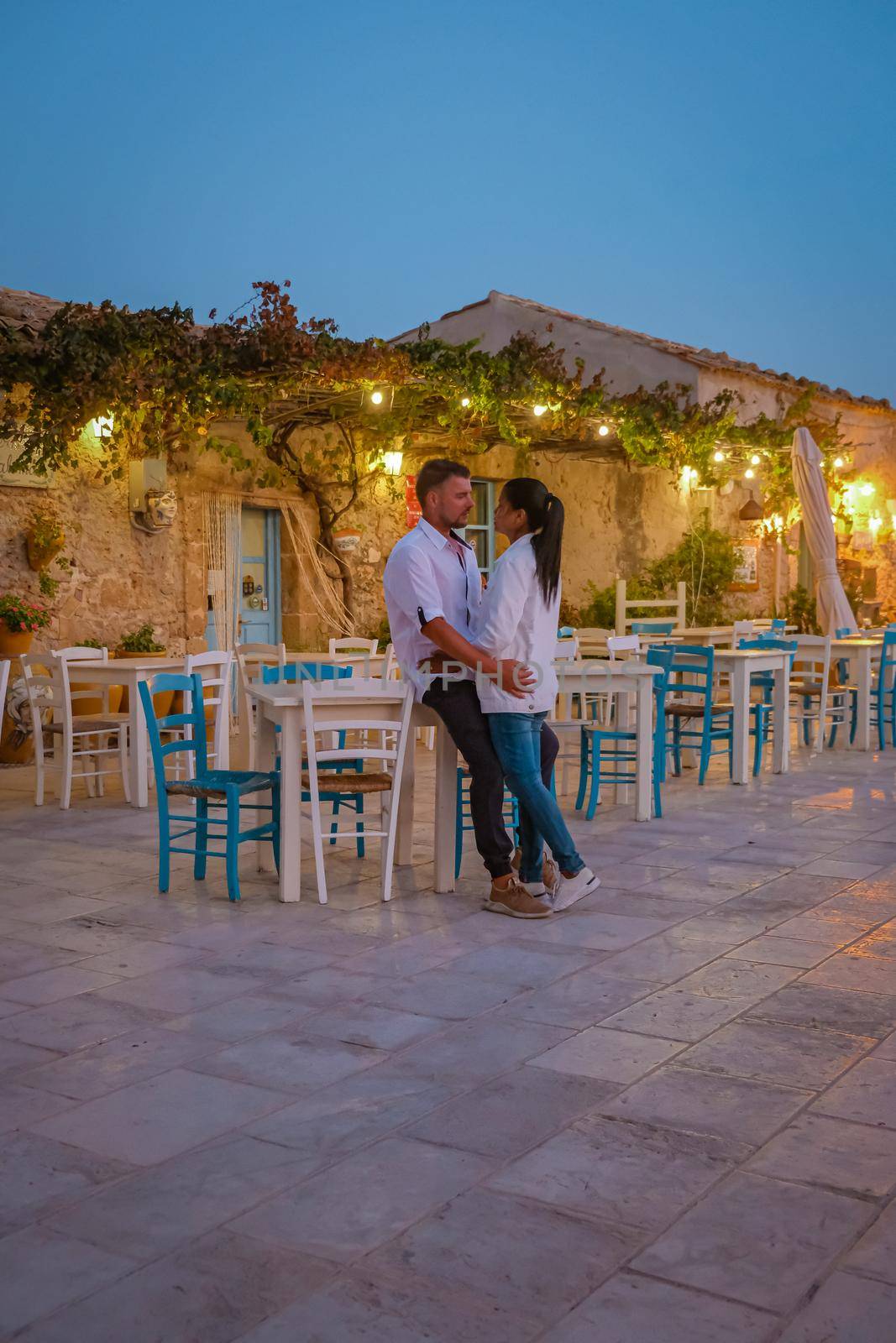 The picturesque village of Marzamemi, in the province of Syracuse, Sicily Italy, a couple on vacation in Sicilia