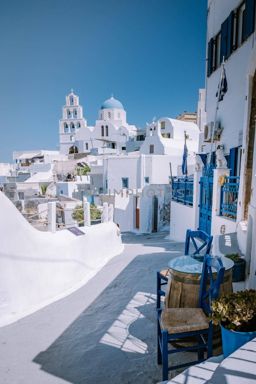 Pyrgos, Santorini, Greece. Famous attraction of white village with cobbled streets, Greek Cyclades Islands, Aegean Sea by fokkebok