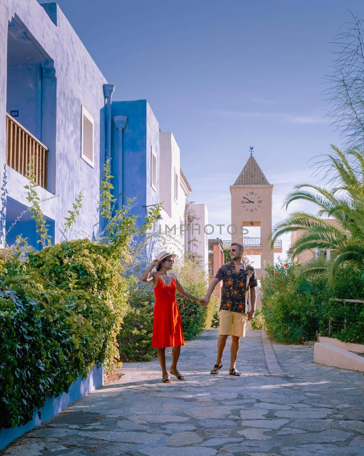 Crete Greece, Candia park village a luxury holiday village in Crete Greece by the ocean in traditional colors. Couple on vacation luxury resort