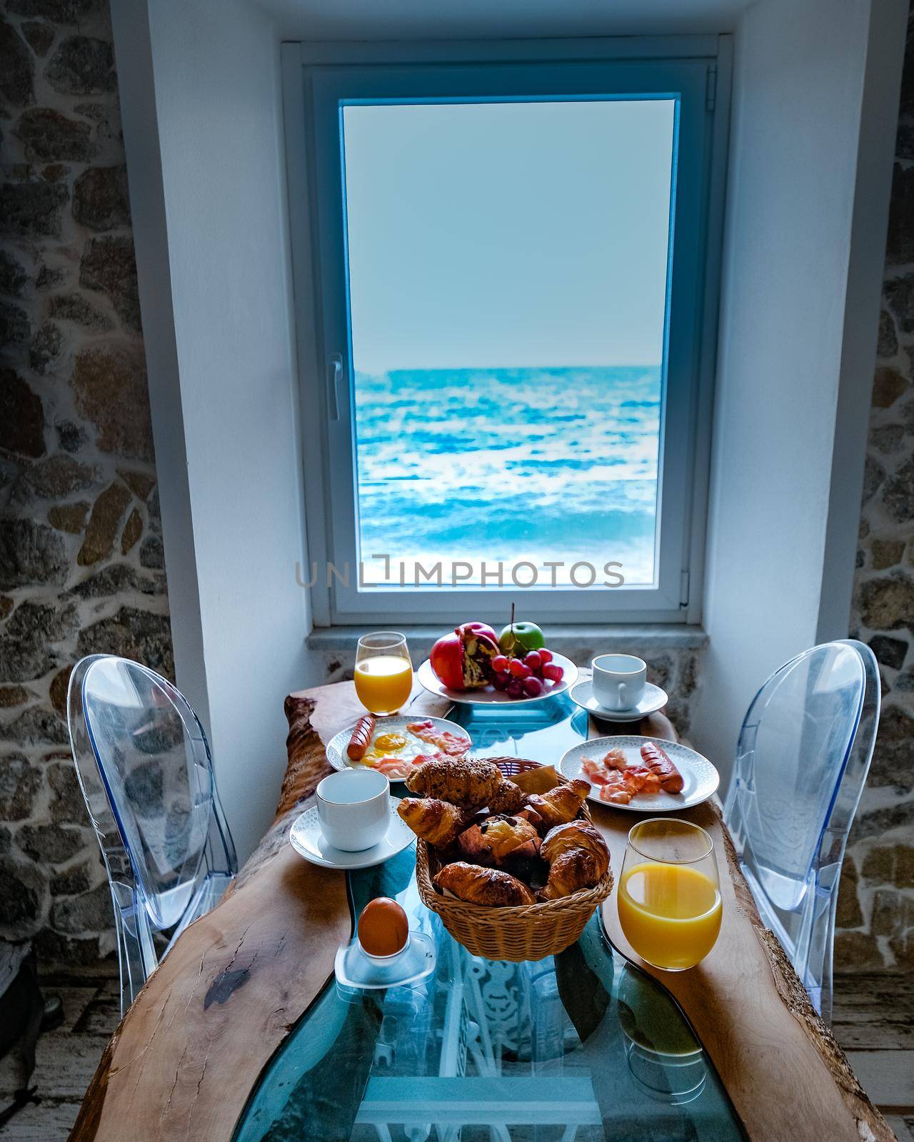breakfast with a view over the ocean from the window, Cefalu, medieval village of Sicily island, Province of Palermo, Italy by fokkebok