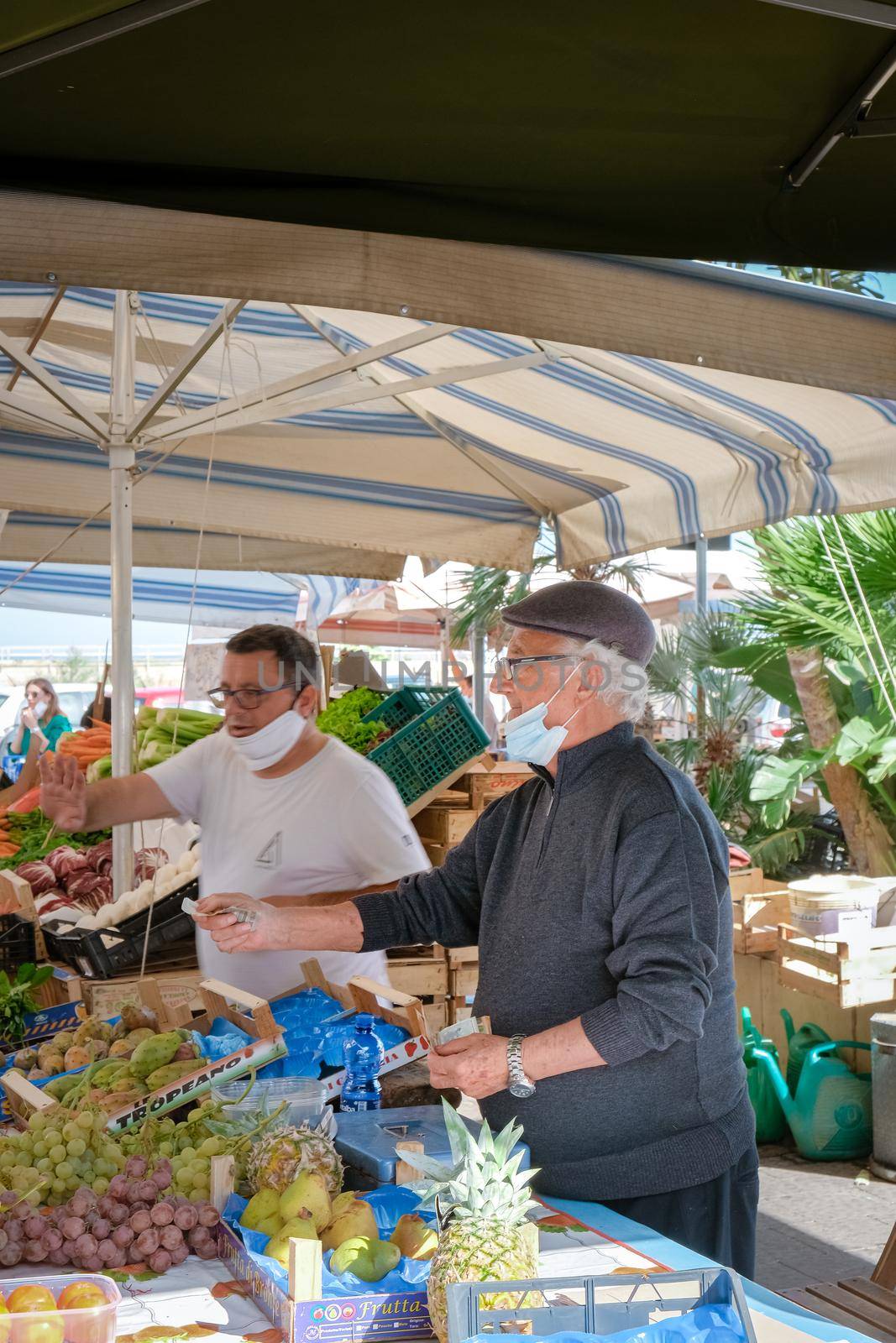 Ortigia in Syracuse Sicily Italy October 2020 in the Morning. Travel Photography from Syracuse, Italy on the island of Sicily. Cathedral Plaza and market with people wearing face protection during the 2020 pandemic covid 19 corona virus