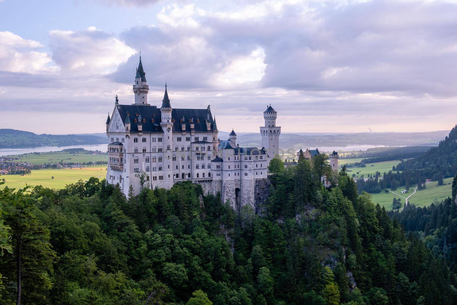 Beautiful view of world-famous Neuschwanstein Castle, the nineteenth-century Romanesque Revival palace built for King Ludwig II on a rugged cliff near Fussen, southwest Bavaria, Germany by fokkebok