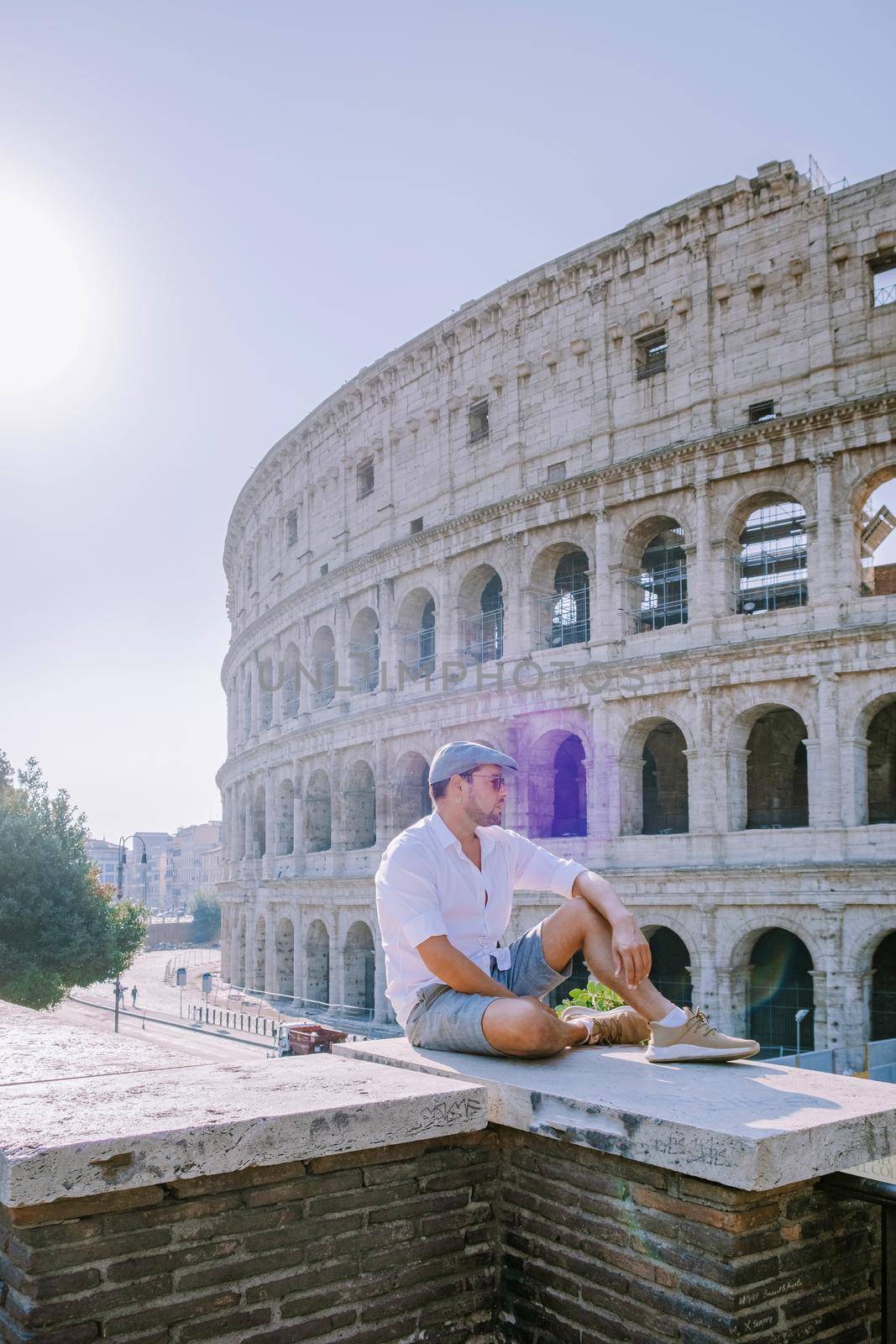 View of Colosseum in Rome and morning sun, Italy, Europe by fokkebok