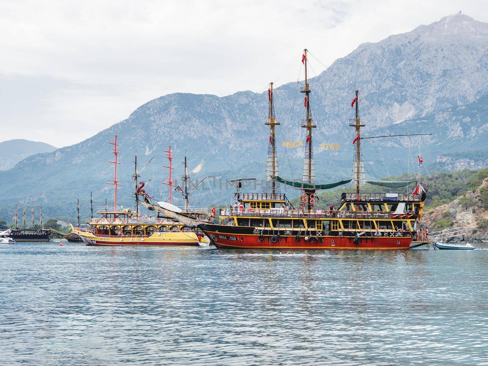 PHASELIS, TURKEY - May 19, 2018. Touristic vintage yachts are moored at Phaselis harbour. Beautiful ships for tourist trips on the Mediterranean sea. by aksenovko