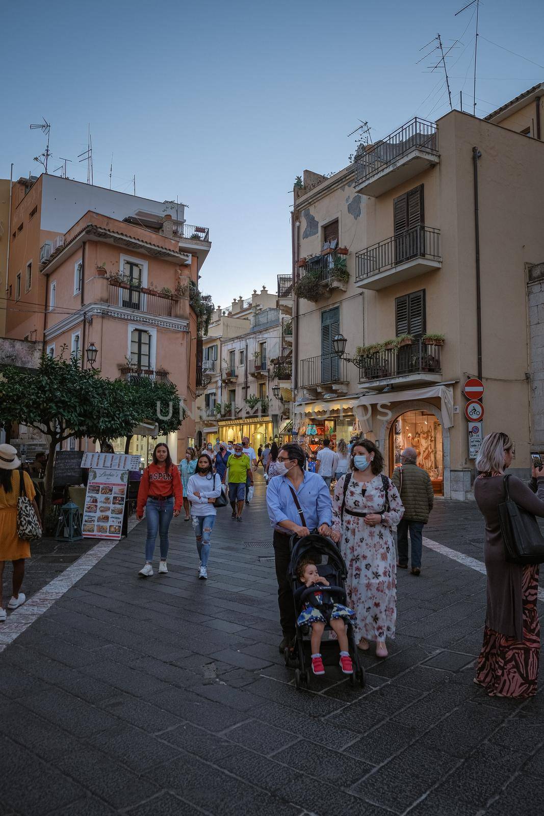 Taormina Sicily Italy October 2020, people on the streets using face mask during the pandemic Corona Covid 19 virus outbreak. 