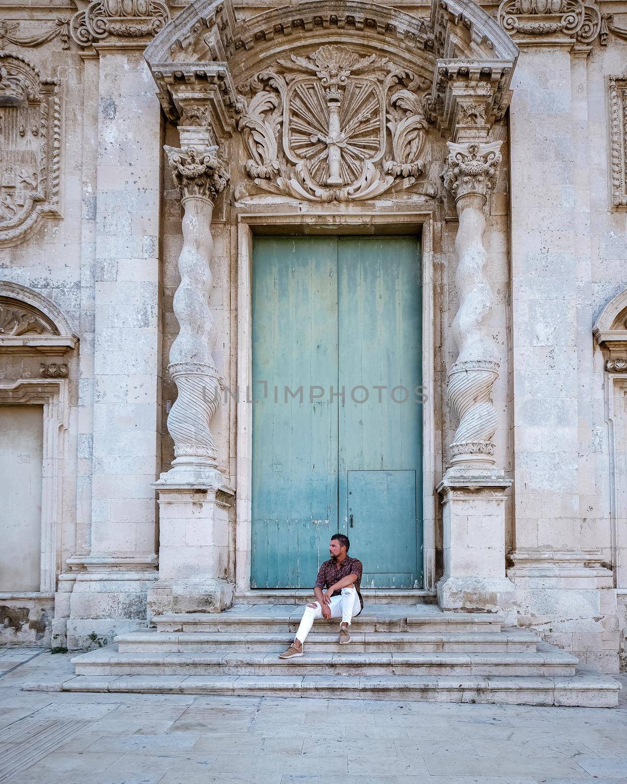 men on citytrip, Ortigia in Syracuse Sicily Italy in the Morning. Travel Photography from Syracuse, Italy on the island of Sicily. 