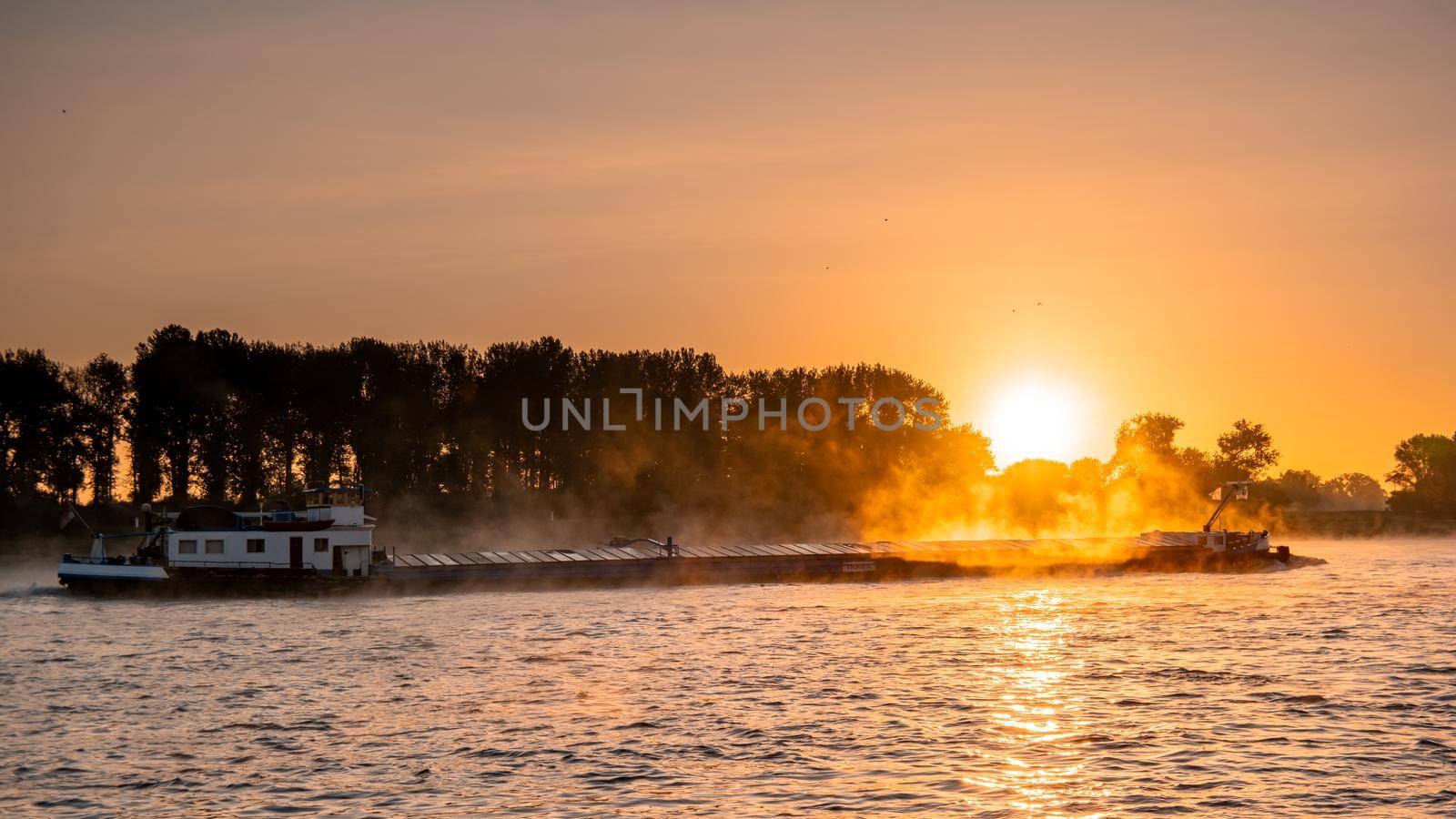 Cologne Germany August 2020, Inland shipping transport on the rhine river with containers, Large container and oiltanker vessel on the river rhein in Germany by fokkebok