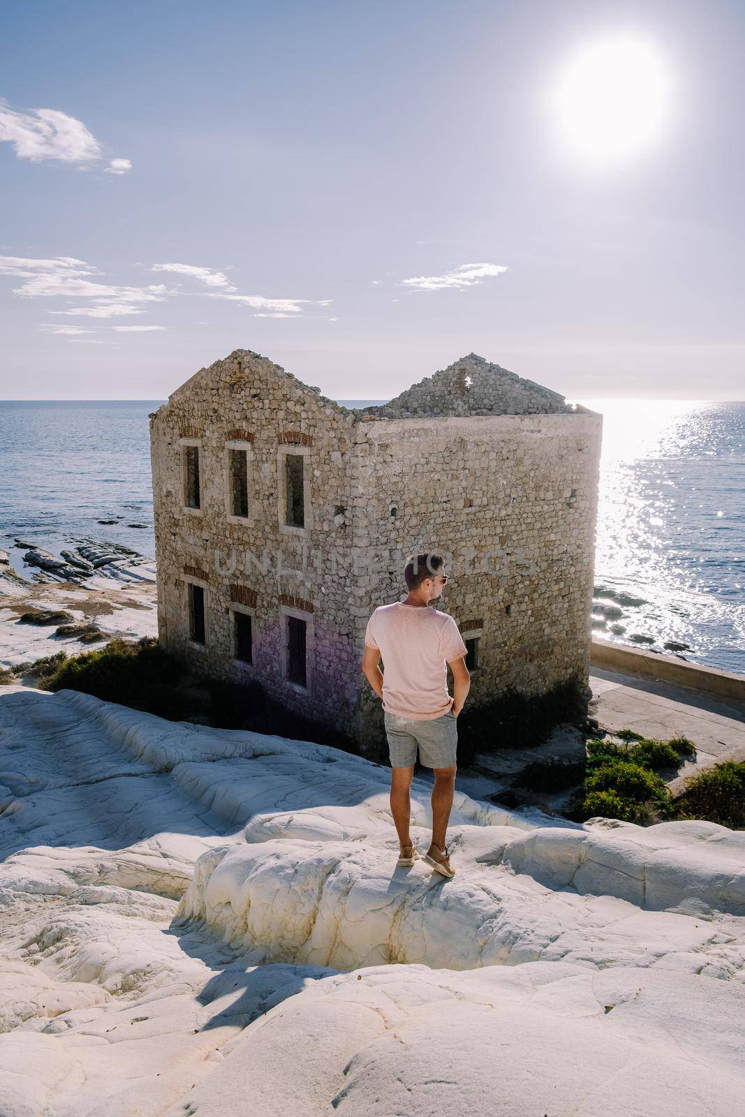 Punta Bianca, Agrigento in Sicily Italy White beach with old ruins of an abandoned stone house on white cliffs. Sicilia Italy you men on the white cliffs