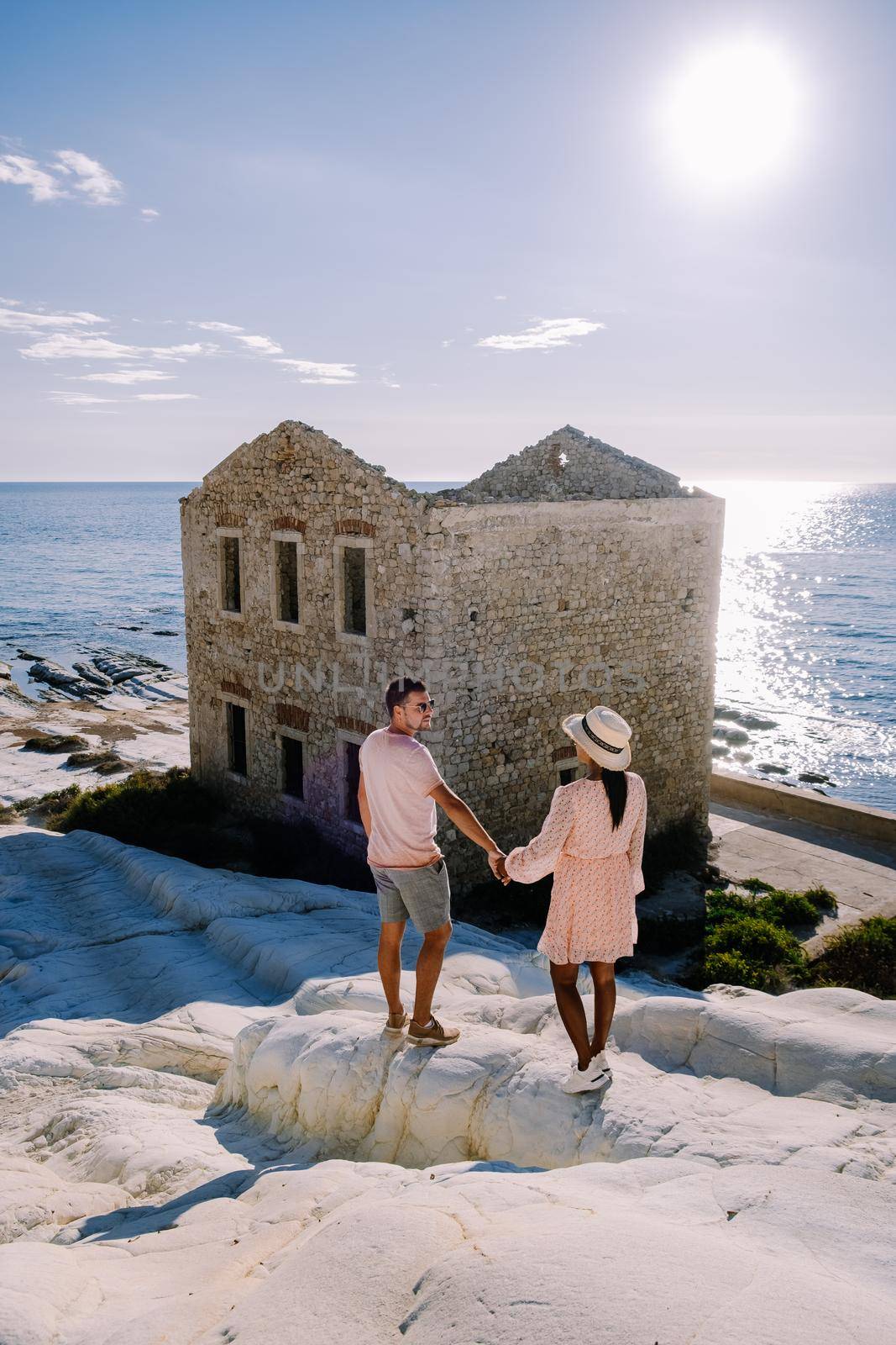 Punta Bianca, Agrigento in Sicily Italy White beach with old ruins of an abandoned stone house on white cliffs. Sicilia Italy, couple on vacation in Italy