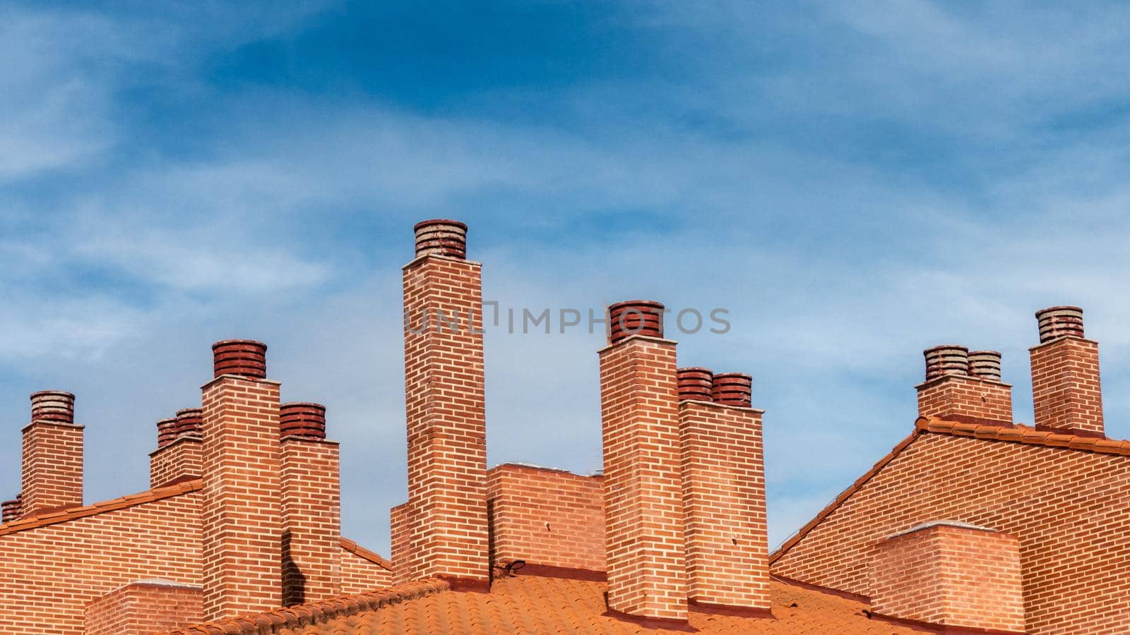 chimney stacks seen on spanish roof tops