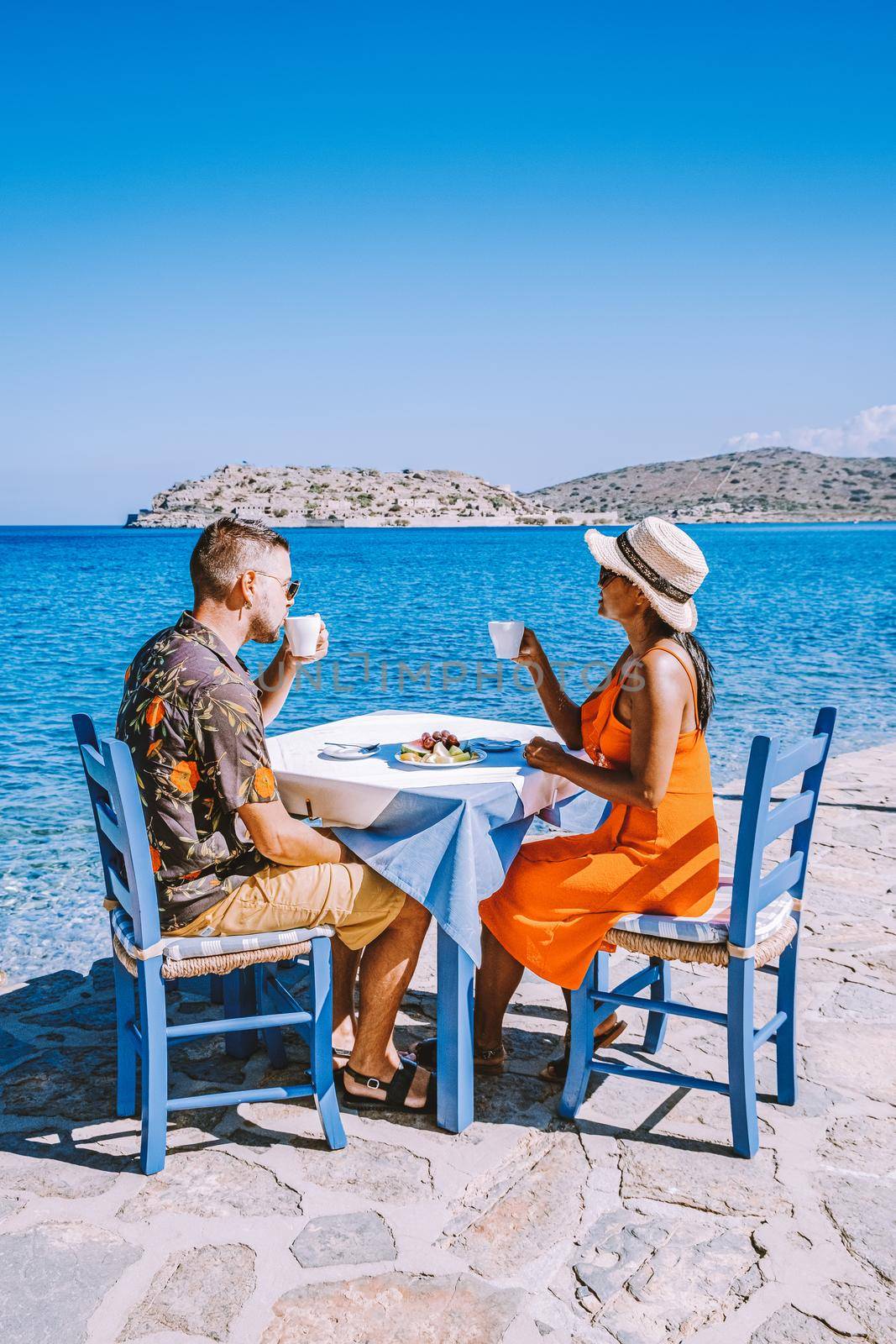 couple men and woman mid age on vacation at the Greek Island Crete by fokkebok