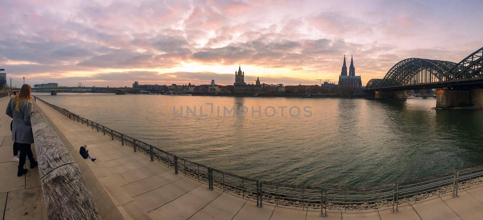 Cologne Germany alongside the rhein river during sunset with the huge Cathedral by fokkebok