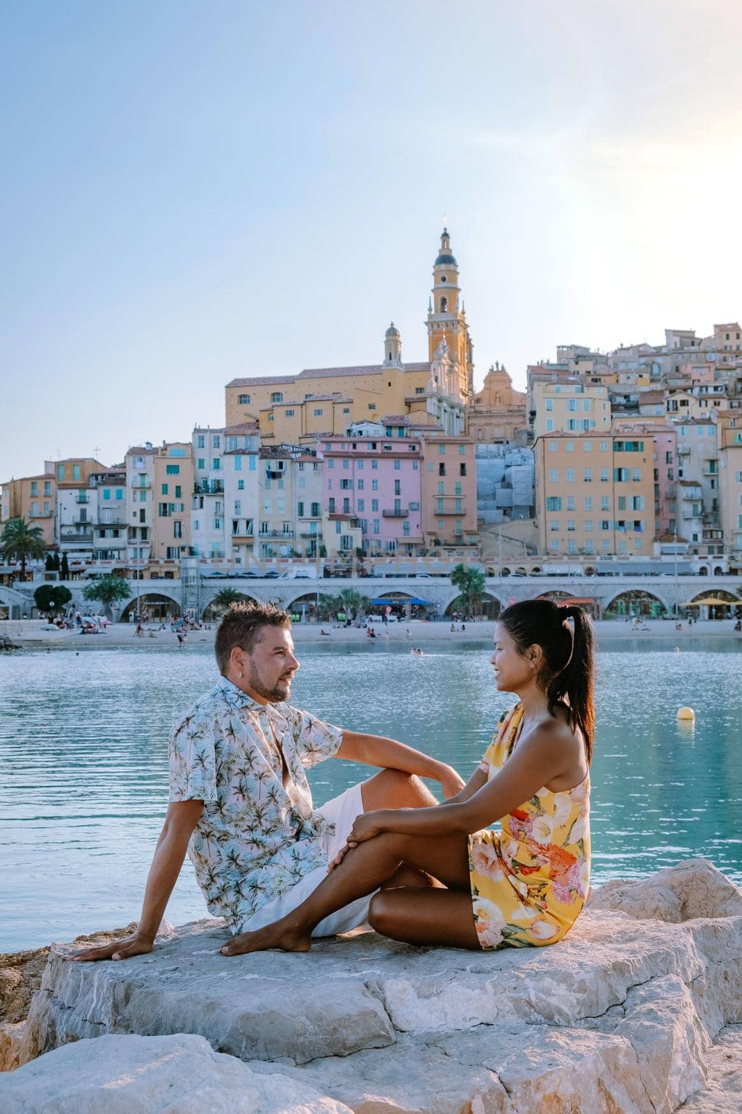 Menton France,couple men and woman on vacation at the Cote d Azur France, View on old part of Menton, Provence-Alpes-Cote d'Azur, France by fokkebok