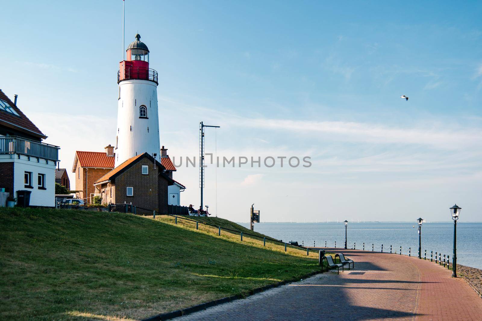 Urk Netherlands harbor and lighthouse near the beach on a bright summer day Flevoland Urk Netherlands Europe