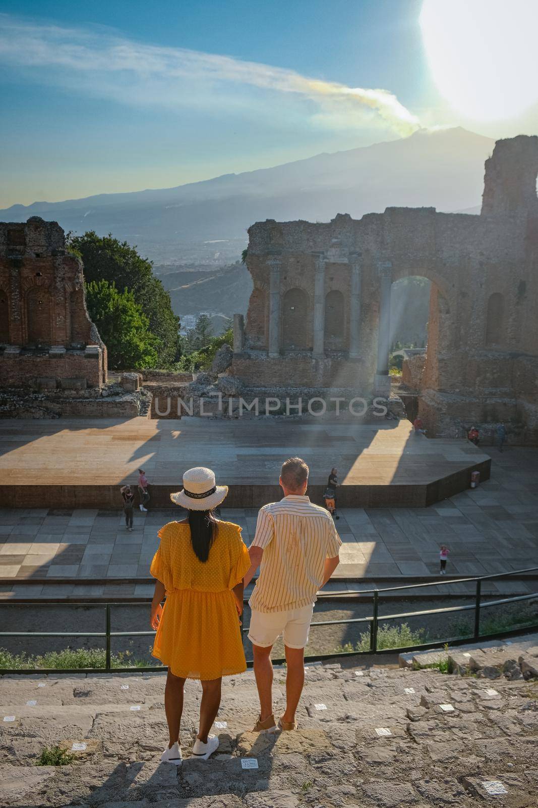 Taormina Sicily, Belvedere of Taormina and San Giuseppe church on the square Piazza IX Aprile in Taormina. Sicily, Italy. Couple on vacation at the Italian Island Sicily