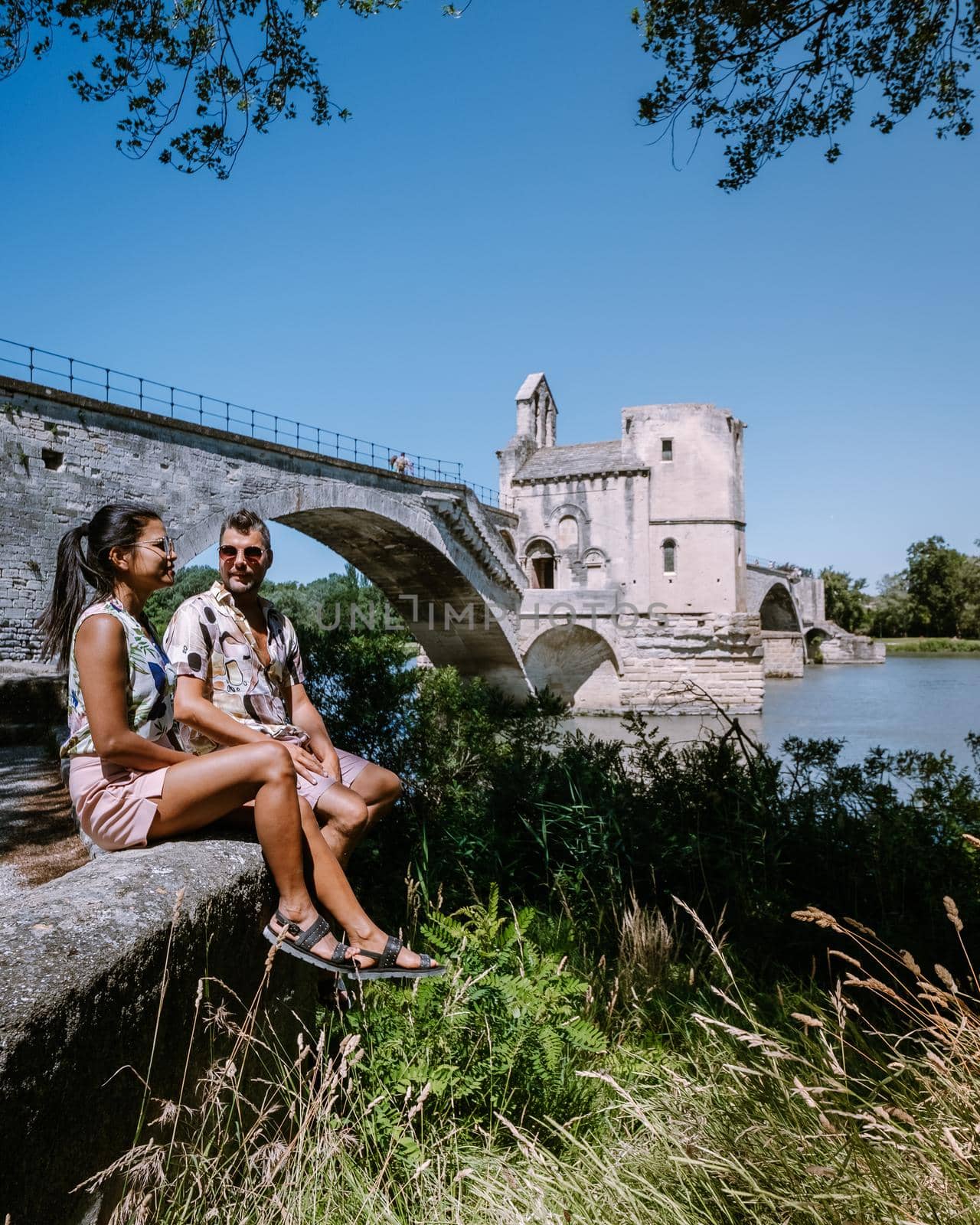 couple city trip Avignon Southern France, Ancient Popes Palace, Saint-Benezet, Avignon, Provence, France by fokkebok