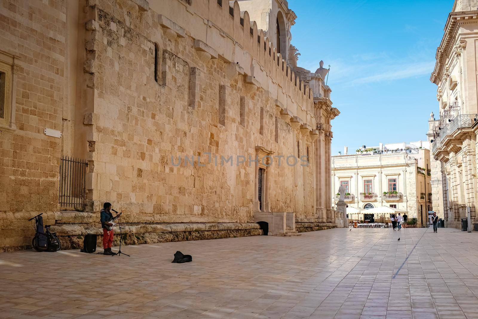 Ortigia in Syracuse in the Morning. Travel Photography from Syracuse, Italy on the island of Sicily. Cathedral Plaza and market with people whear face protection during the 2020 pandemic by fokkebok