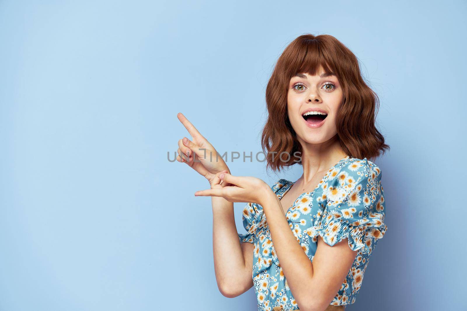 Woman portrait finger gesture open mouth Copy Space short hair summer clothes
