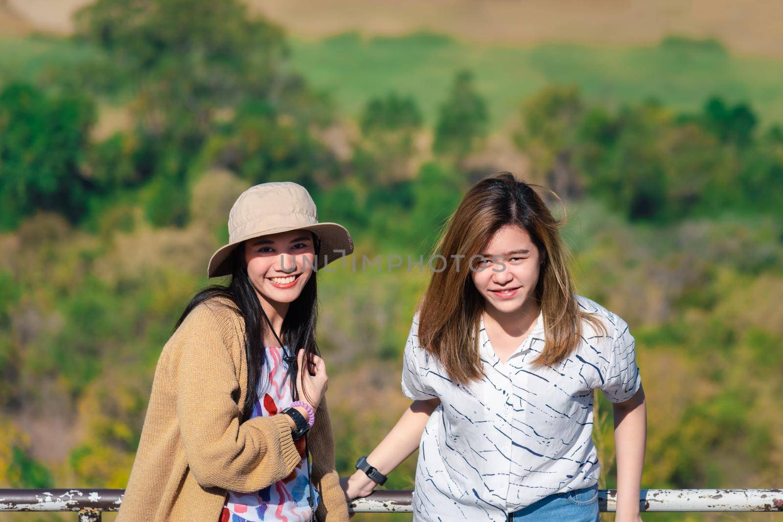 Asian pretty cute women with hat relax at seaside city landscape viewpoint on mountain with happy and freedom emotion in concept travel, vacation, leisure in life