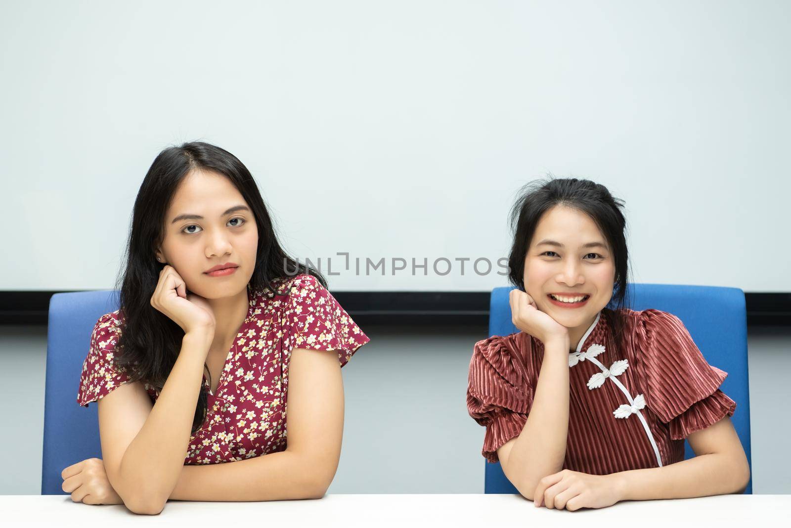 Asian pretty women in cheongsam chinese style great happy joyful and coworker discussion in meeting room in office with happy and smile in concept success, winner, successful or business