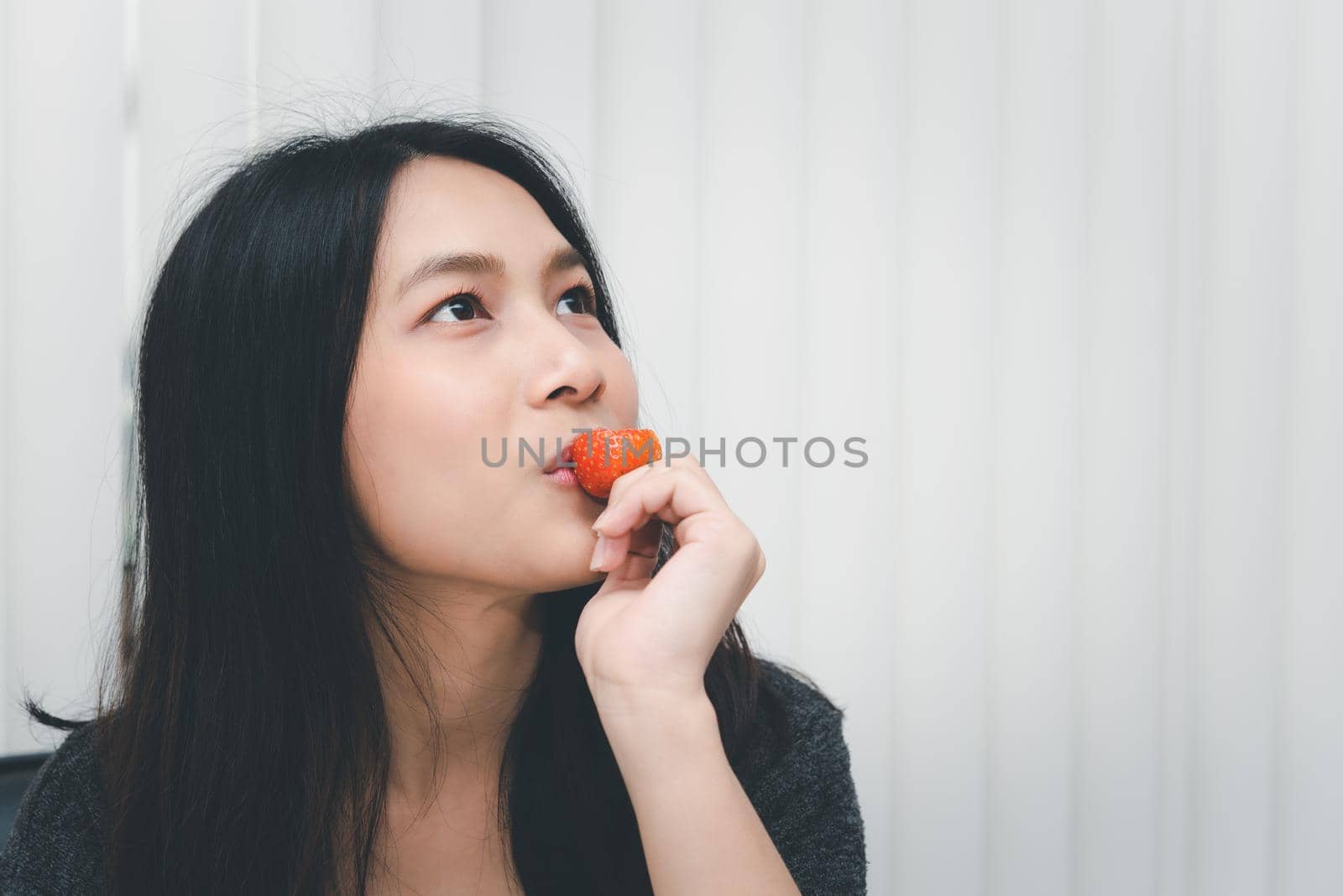 Woman eat strawberry red berry fruit sweet juicy by PongMoji