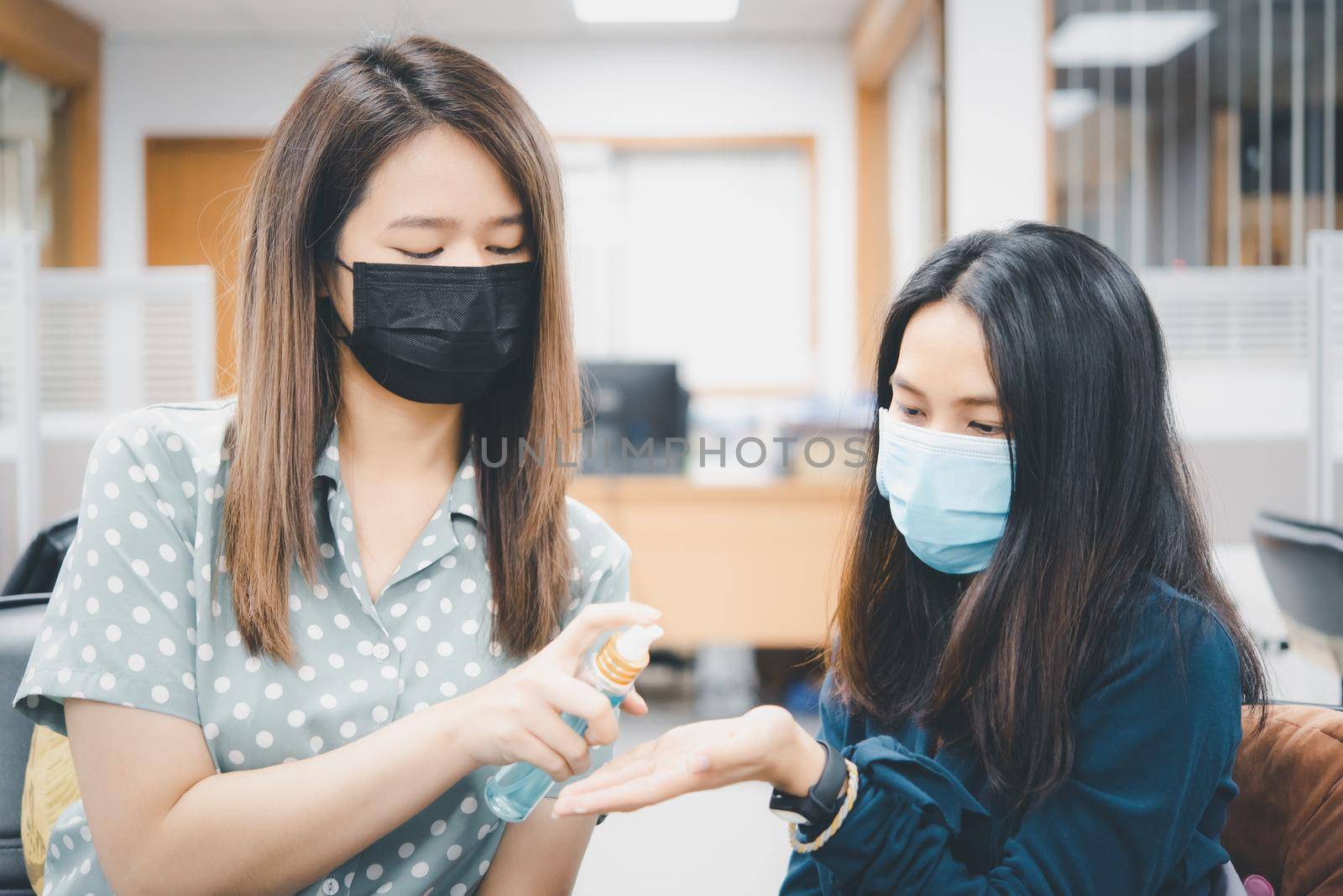 Asian women wearing mask and alcohol antibacterial hand gel respiratory protection mask against epidemic flu covid19 or corona virus with fear emotion in concept illness, outbreak, healthcare in life