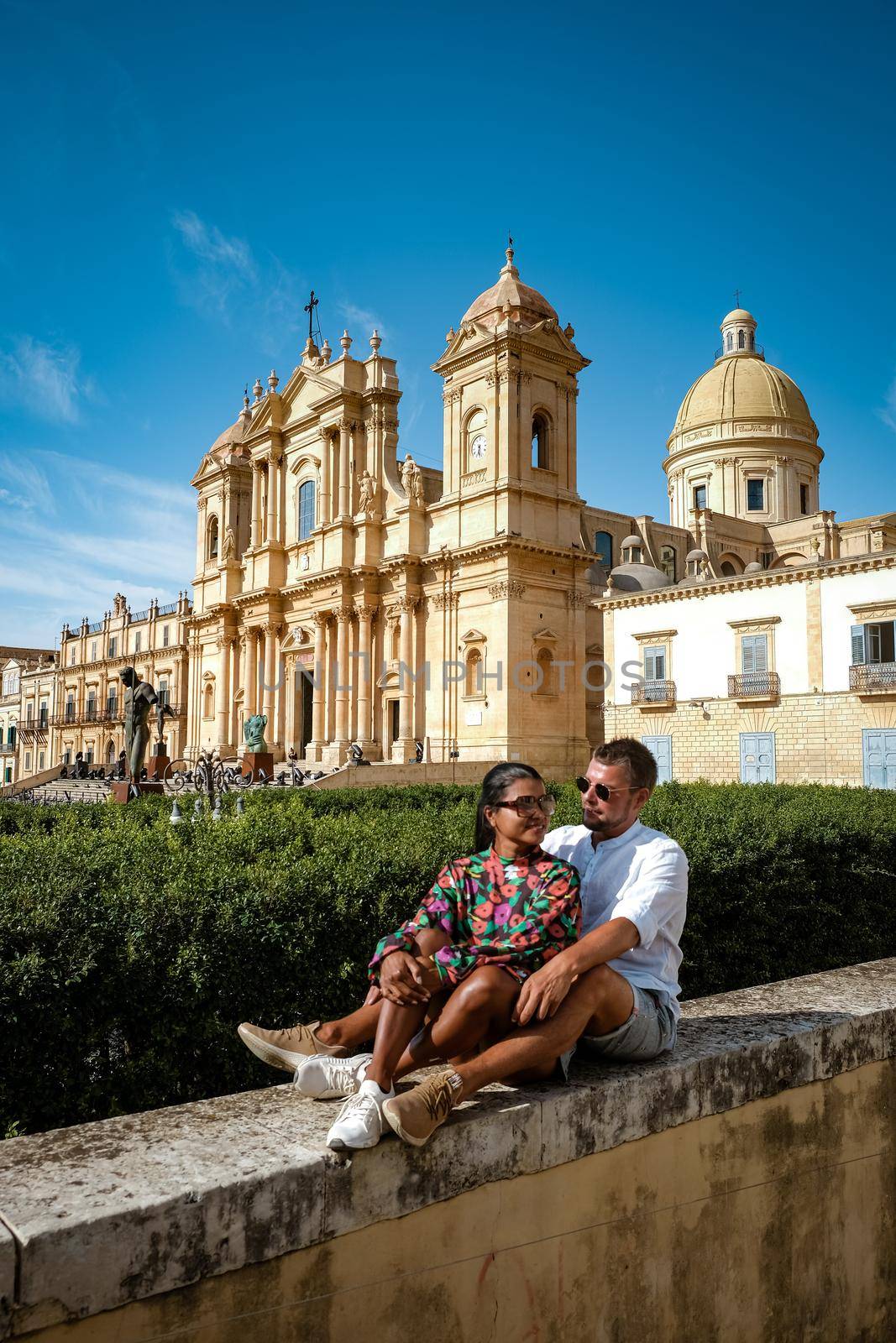 Sicily Italy, view of Noto old town and Noto Cathedral, Sicily, Italy. beautiful and typical streets and stairs in the baroque town of Noto in the province of Syracuse in Sicily, a couple on city trip Noto