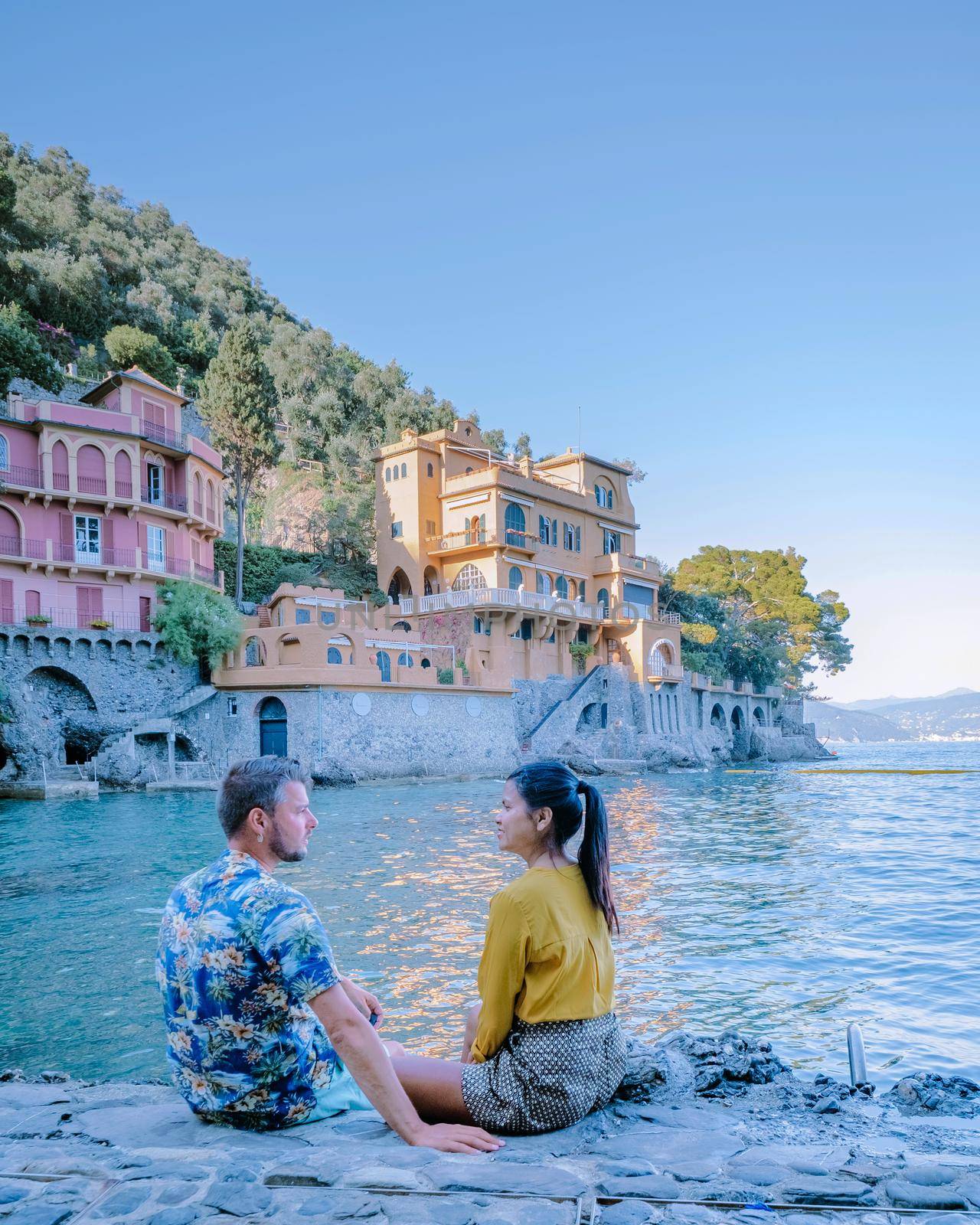 couple on vacation ligurian coast Italy,Portofino famous village bay, Italy Europe colorful village Ligurian coast