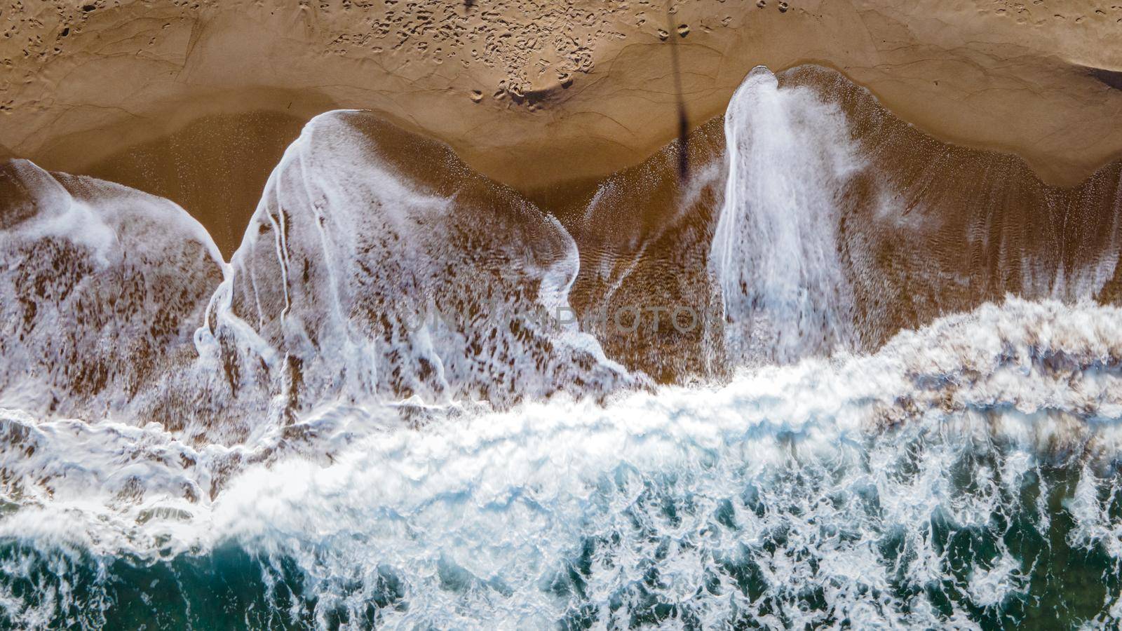 huge big waves from above at the Island of Sicily, drone view at beach and huge waves by fokkebok