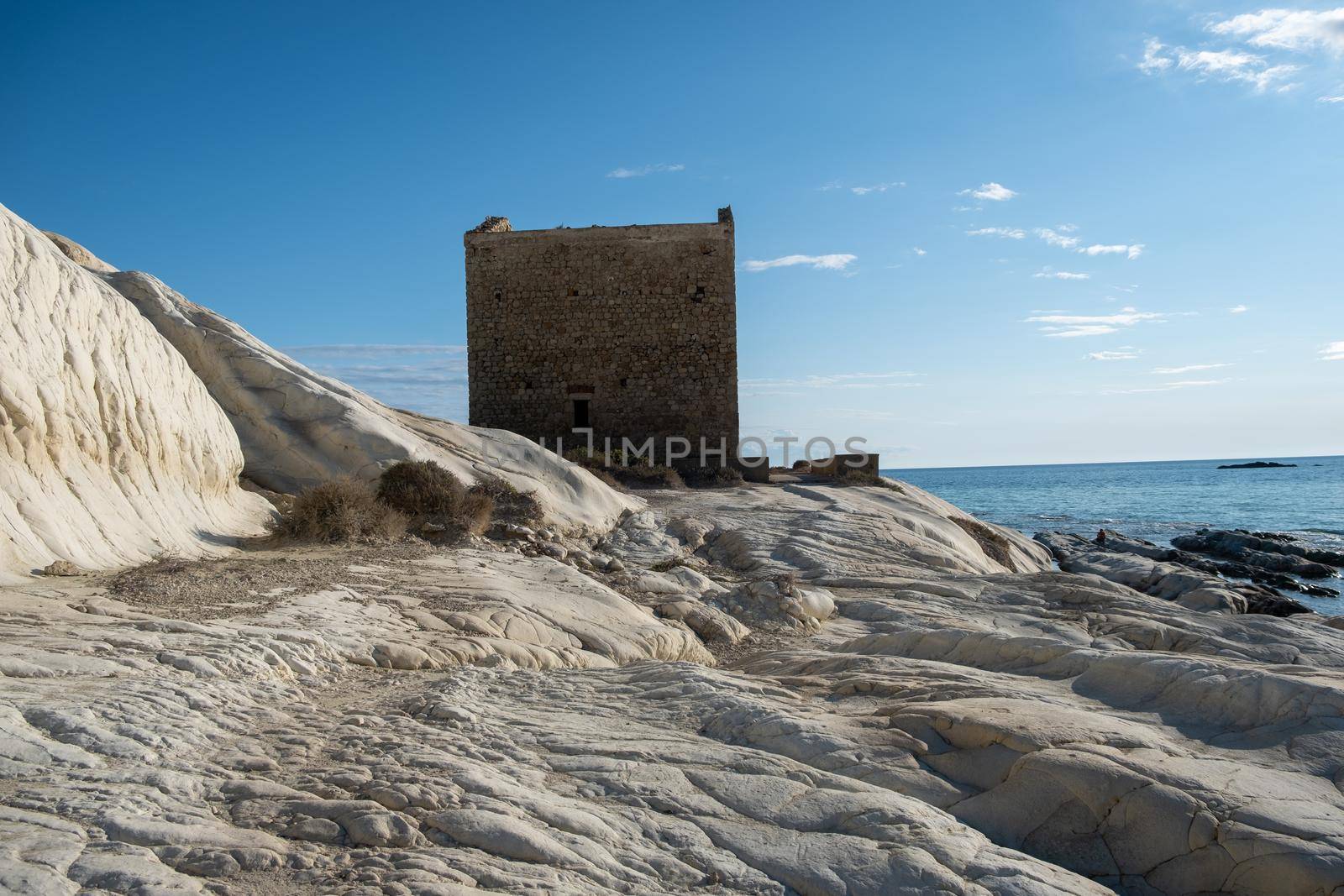 Punta Bianca, Agrigento in Sicily Italy White beach with old ruins of an abandoned stone house on white cliffs. Sicilia Italy