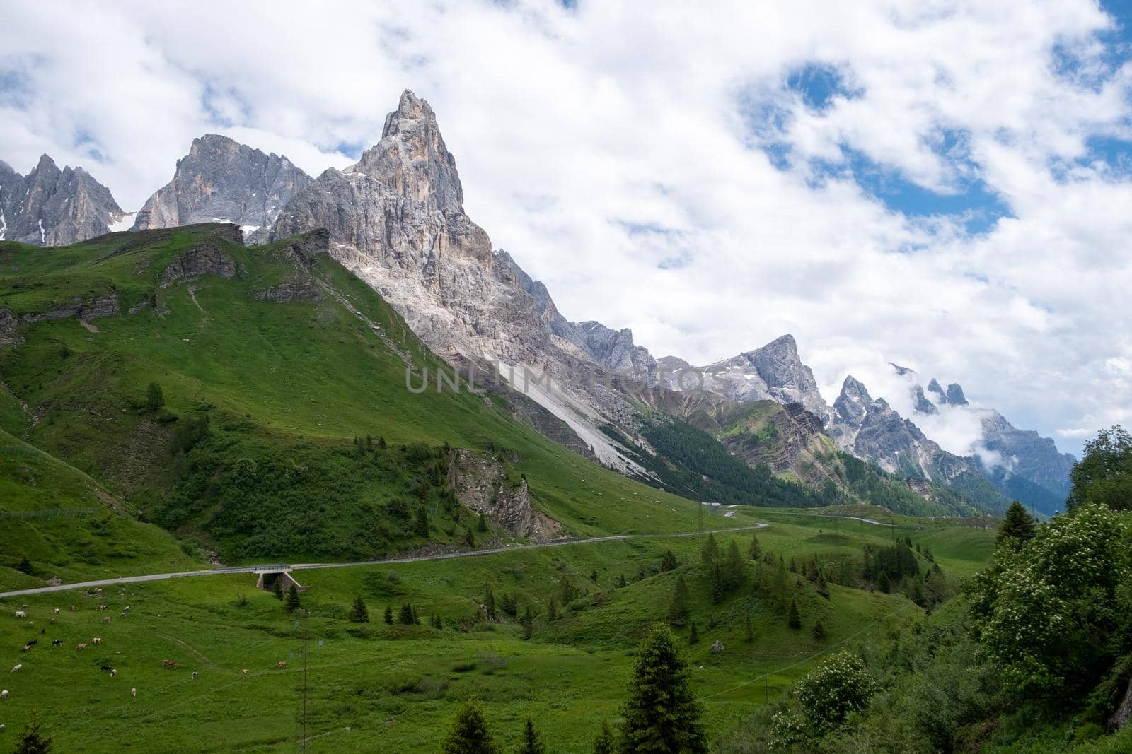 Pale di San Martino from Baita Segantini - Passo Rolle italy,Couple visit the italian Alps, View of Cimon della Pala, the best-know peak of the Pale di San Martino Group in the Dolomites, northern Italy Europe