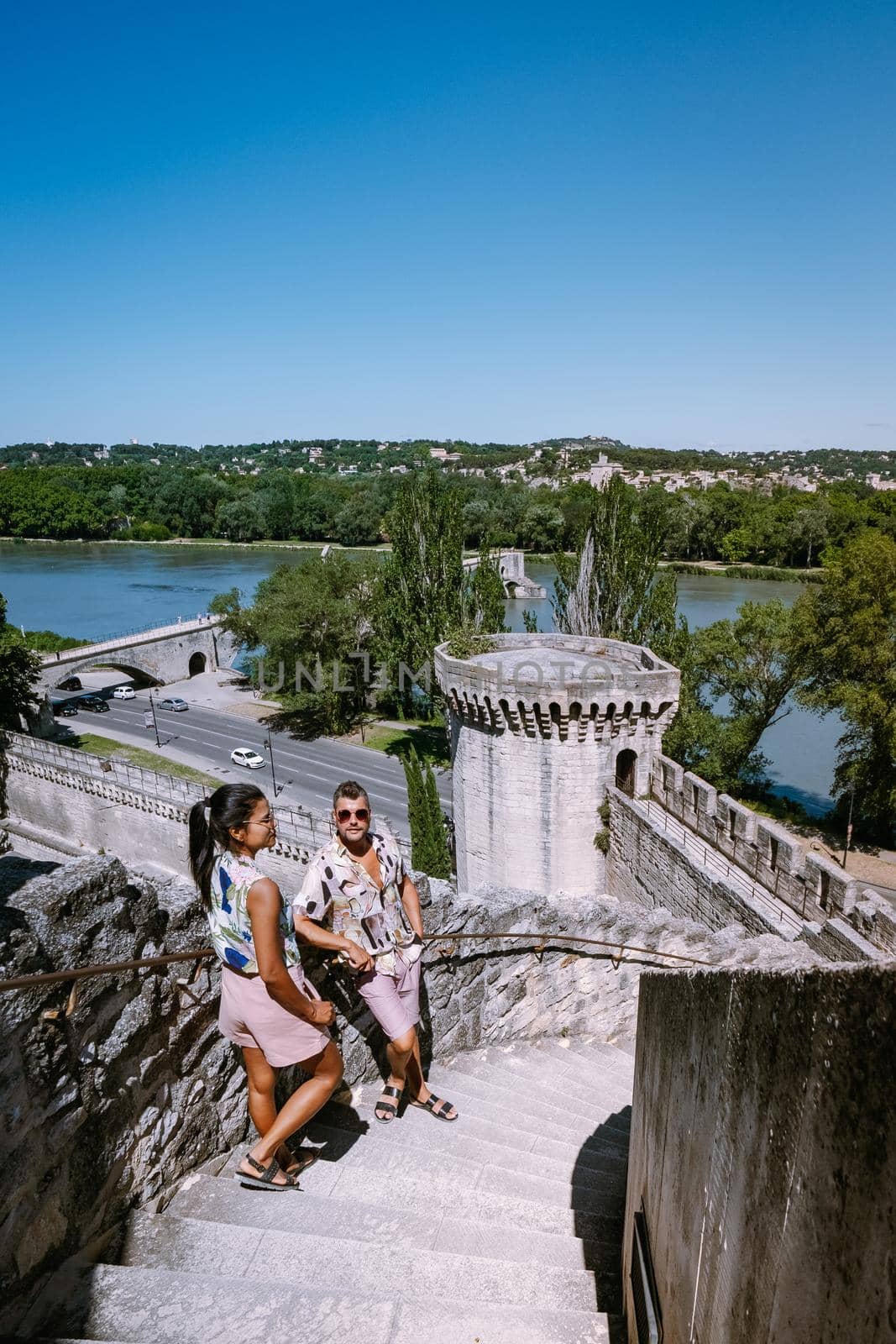 couple city trip Avignon Southern France, Ancient Popes Palace, Saint-Benezet, Avignon, Provence, France by fokkebok