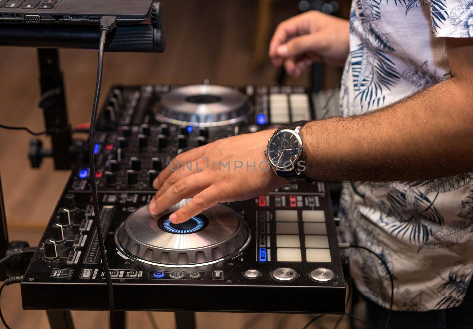 DJ hand in the work process close up by ferhad