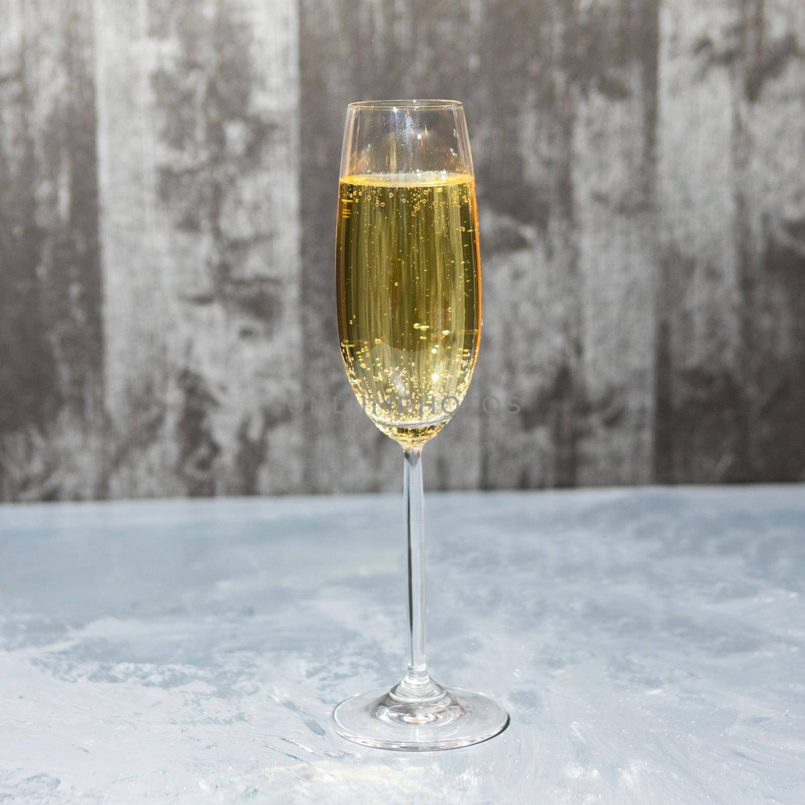 Glass of champagne isolated on a gray background by ferhad