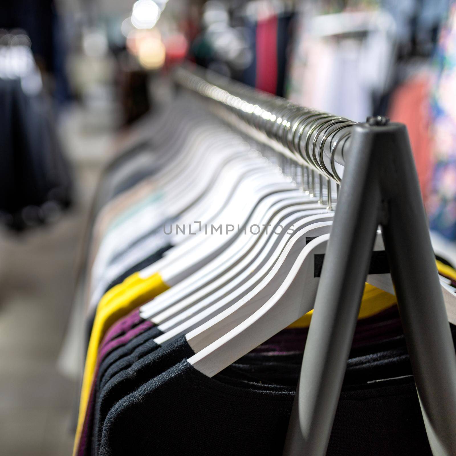 Clothes on the hanger at store close up by ferhad