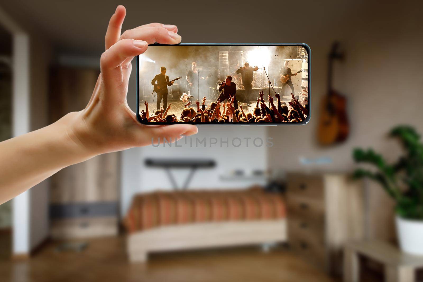 Watching online concert at home by smartphone. Live stream music video. by 9parusnikov