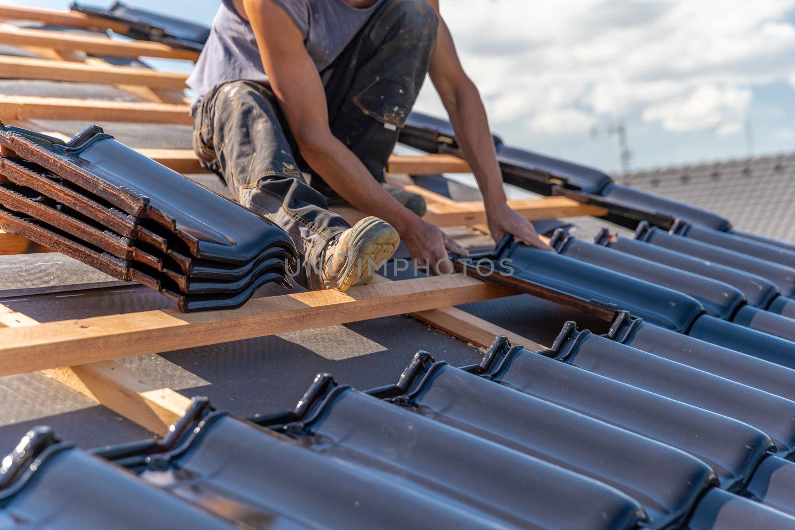 manufacture of the roof of a family house from ceramic tiles. copy space